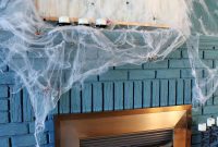 Eerie Elegance: DIY Spiderweb Halloween Mantel