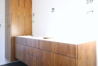 Sleek Simplicity: Floating Walnut Cabinets Transform This Bathroom