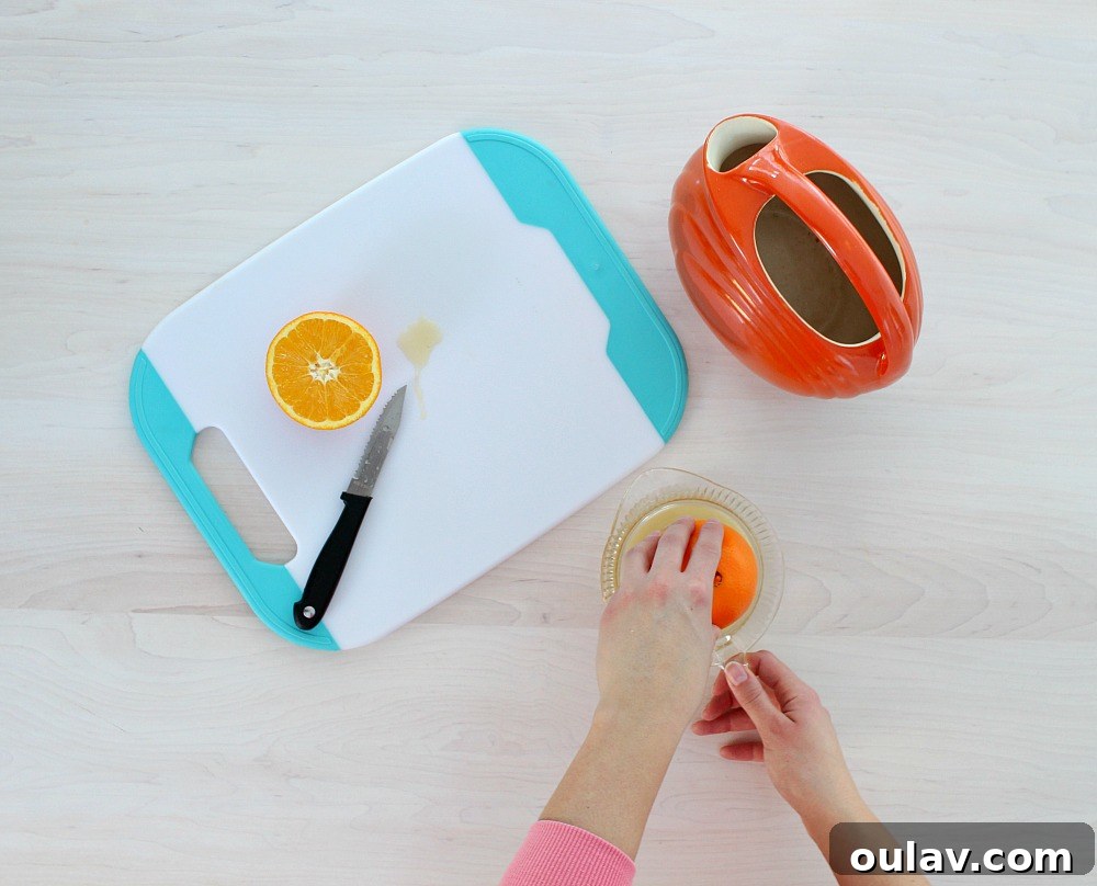 Festive Orange and Turquoise Brunch Tablescape 3 Emergen-C drink preparation