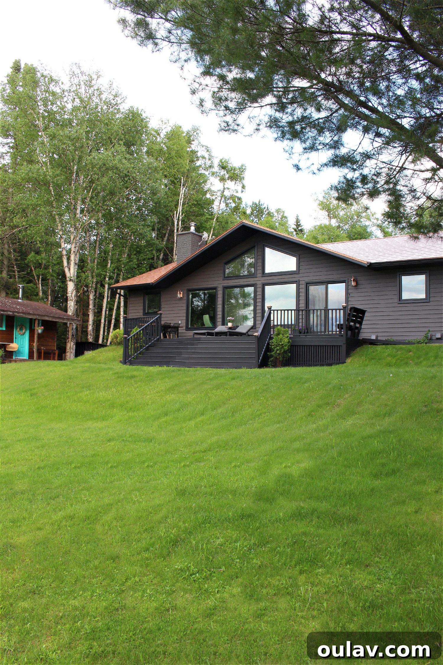 Unveiling Our Lake House Outdoors 11 Modern Lakeside Patio with Black Loungers and DIY Live Edge Table