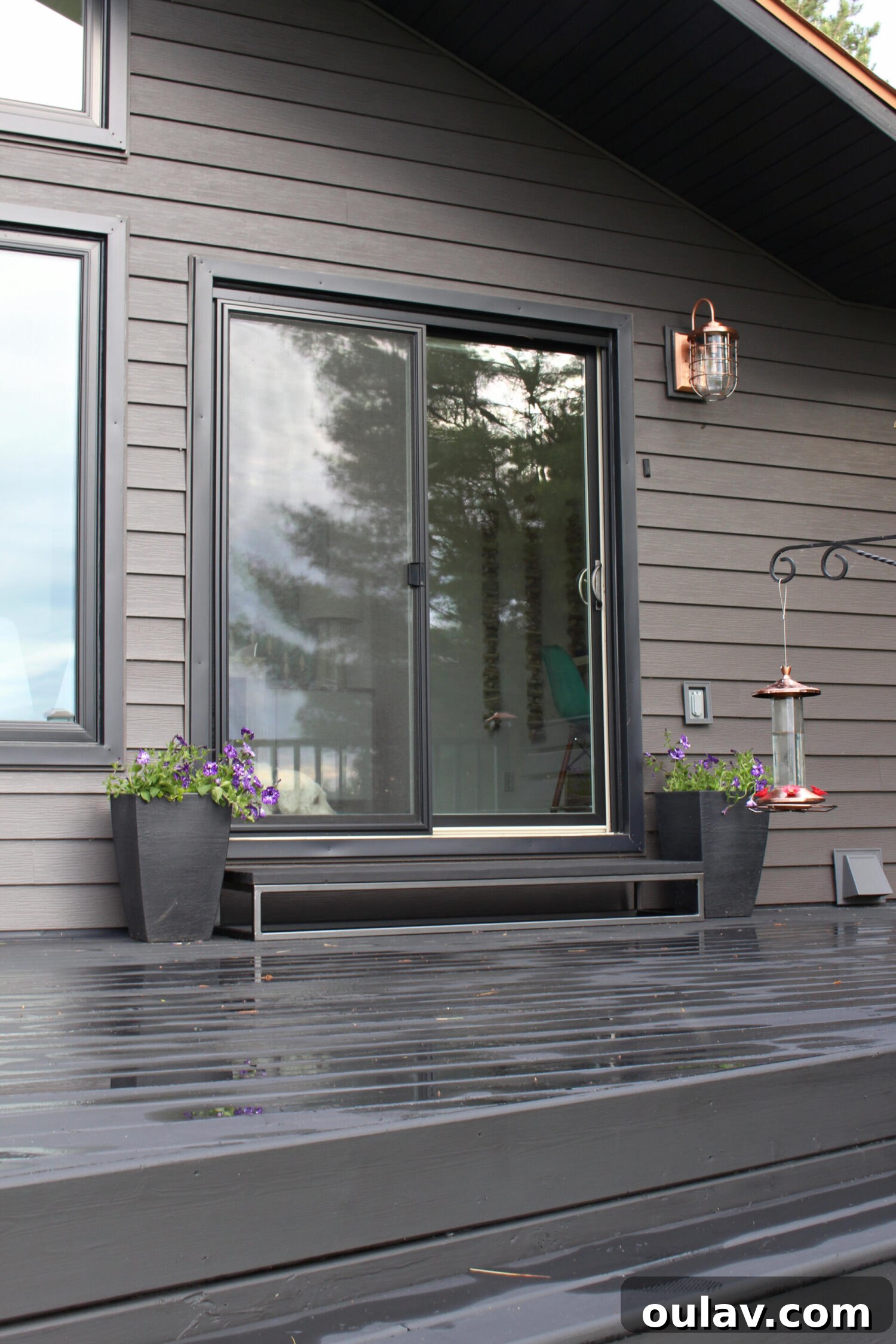 Unveiling Our Lake House Outdoors 14 Dark Grey Metal Siding with Black Trim and Black Decking