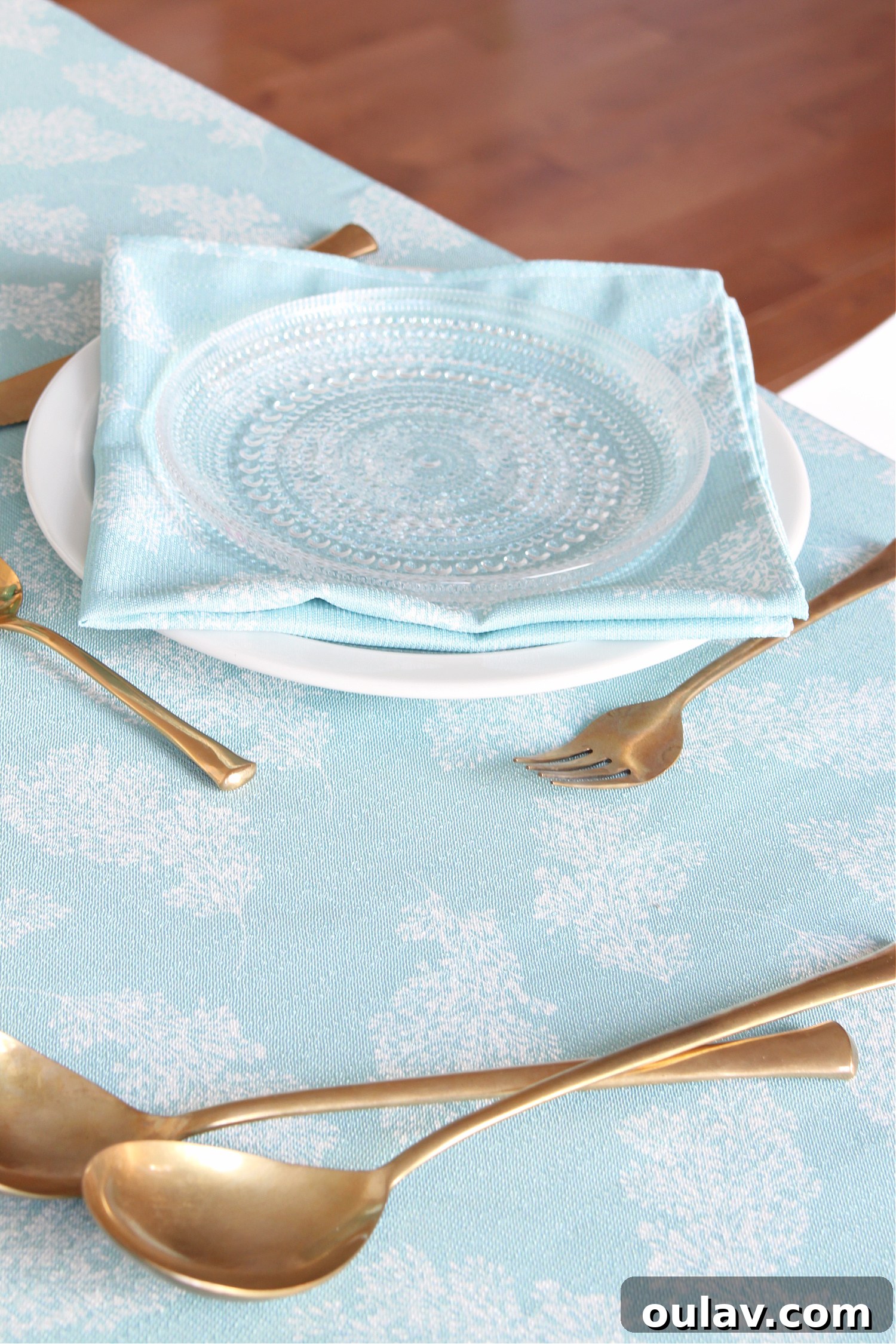 Loom and Table's Summer Dining Oasis 10 Vintage brass flatware complements a modern aqua tablescape
