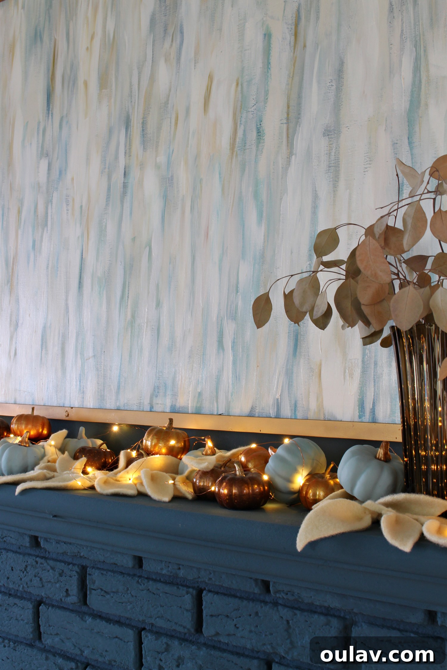 Close-up of Fall Mantel Decor with Pumpkins and Garland