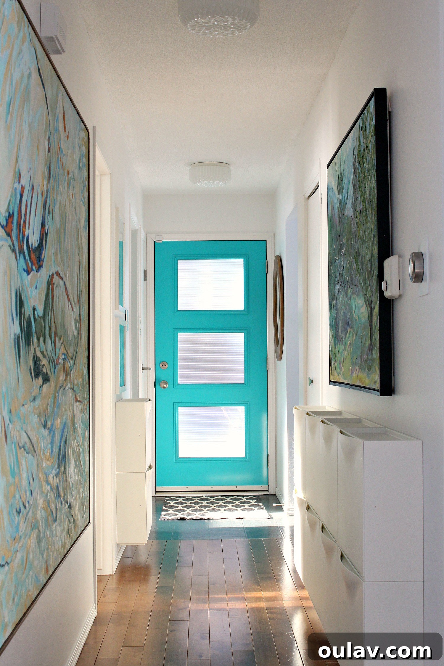 Grandpa's Brushstrokes: A Family Art Journey 34 Turquoise Front Door with large-scale Bert Weir art in hallway