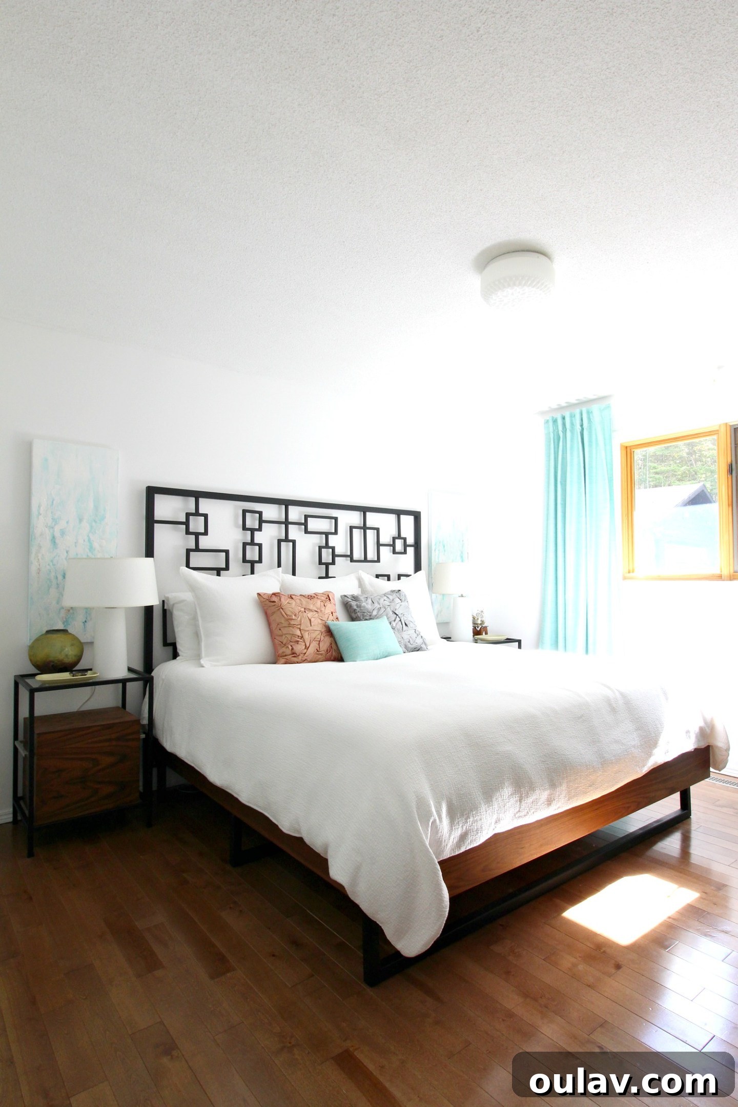 Bedroom in 2018 with pastel palette and inherited artwork