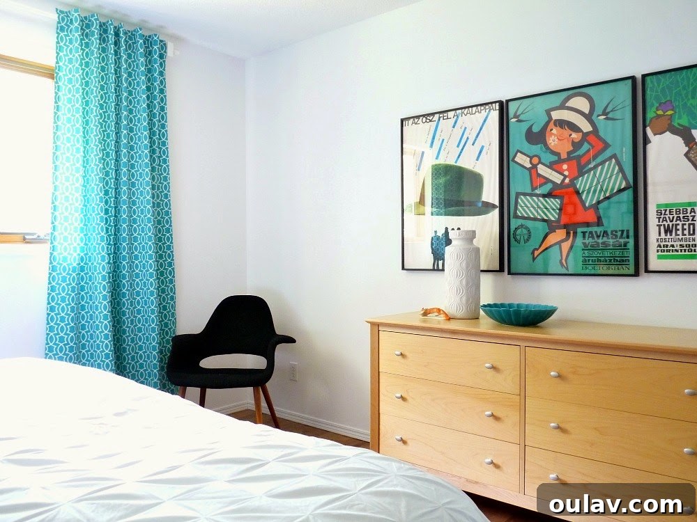 The Bedroom's Style Journey 8 View of bedroom showing the bold teal curtains and black chair