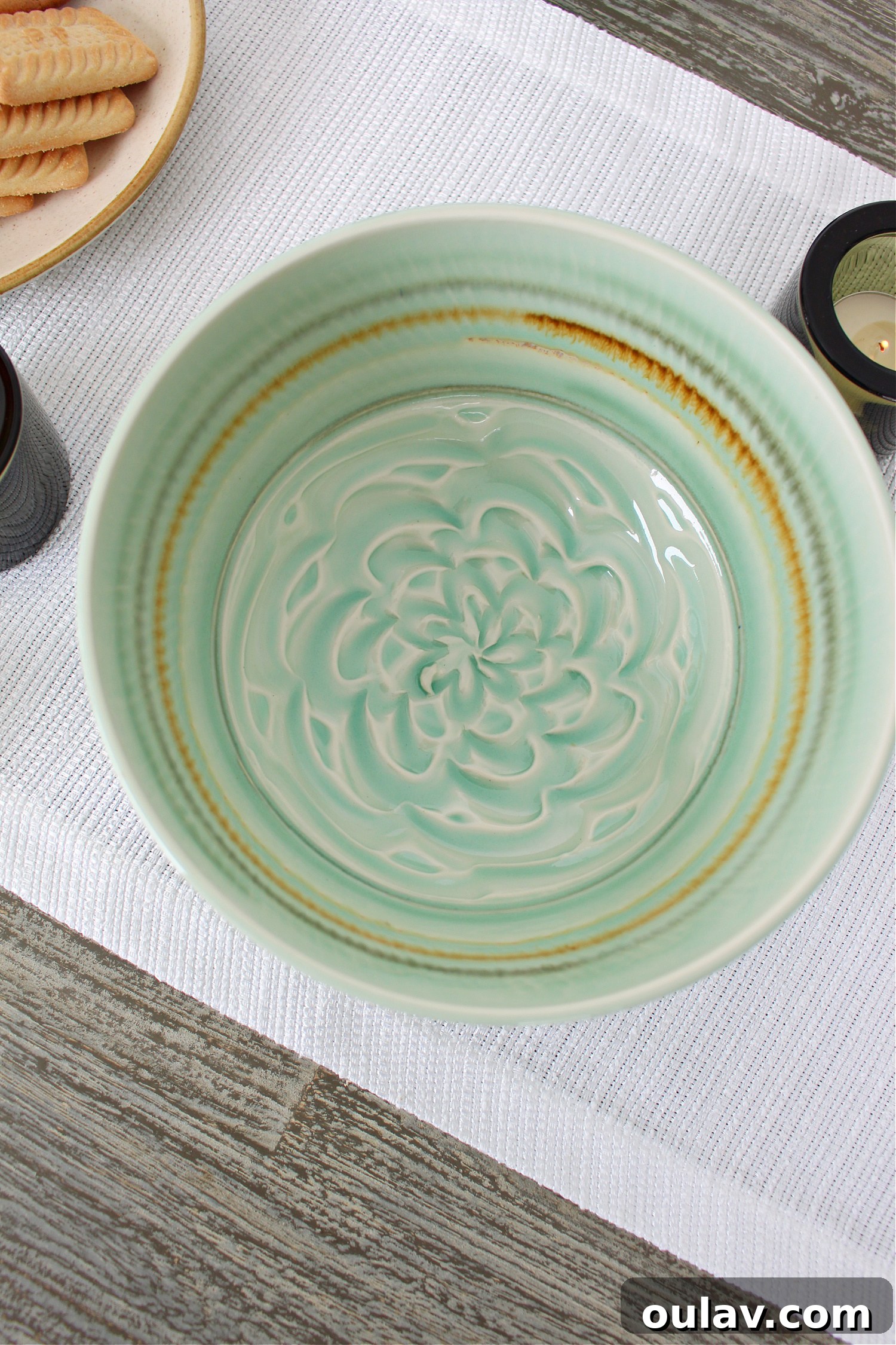 Thrifted Blooms: Vintage Charm for Your Spring Dining Room 11 Pale Green Pottery Bowl with a Beautiful Glaze