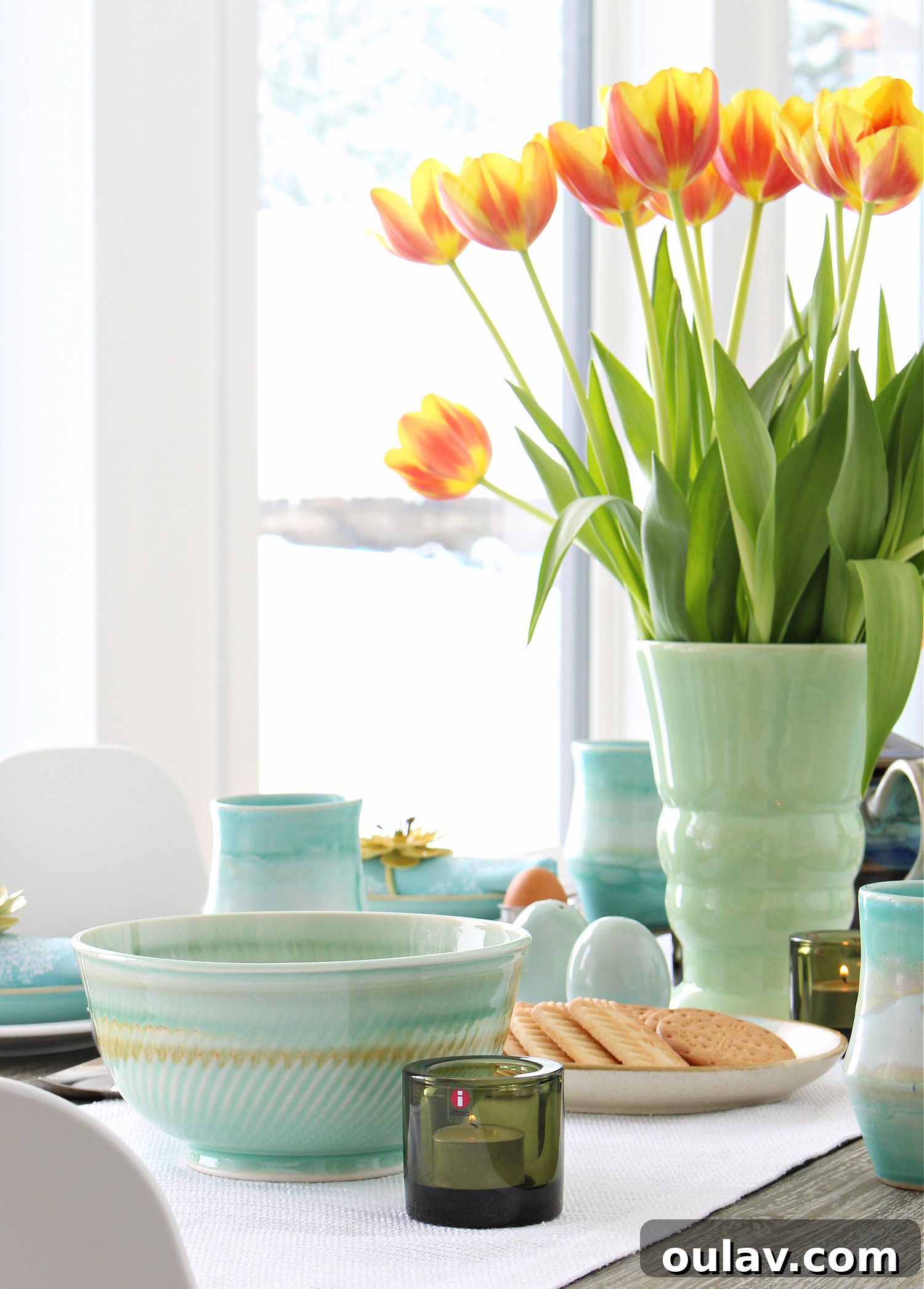 Thrifted Blooms: Vintage Charm for Your Spring Dining Room 10 Moss Green Iittala Votive Holders on a Spring Table