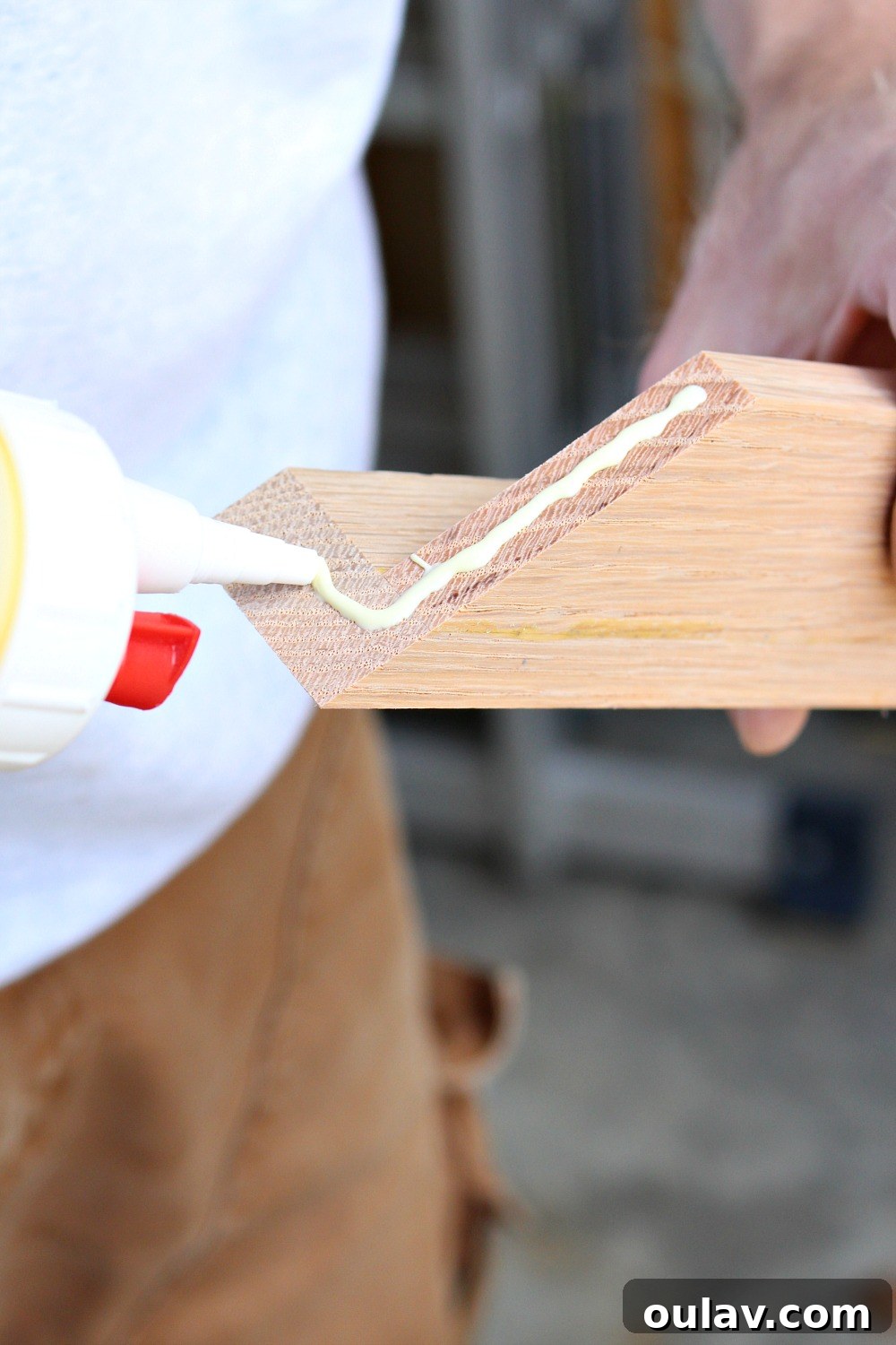 Simple Floating Frame Craft 16 Applying wood glue to mitered frame corners for strong adhesion
