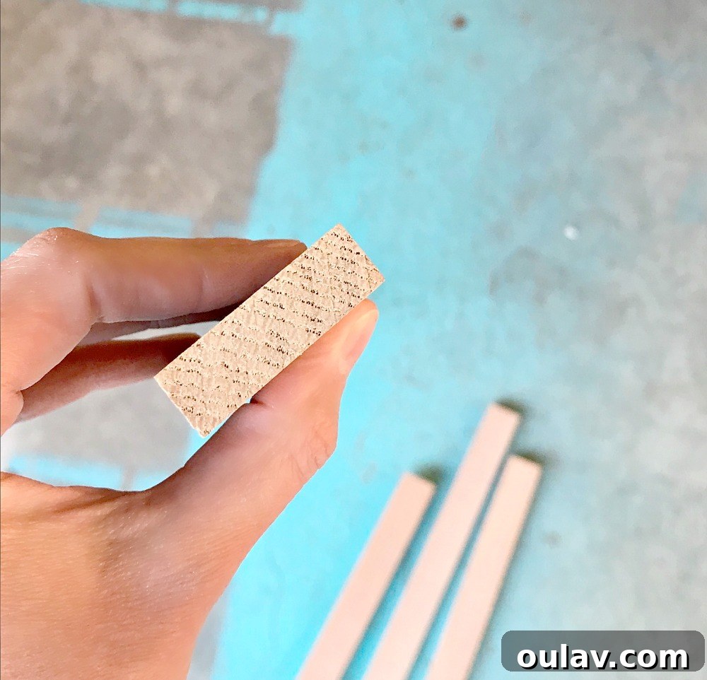 Simple Floating Frame Craft 6 Inspecting wood boards for straightness before DIY floating frame construction