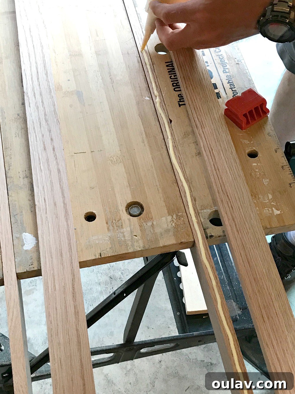 Simple Floating Frame Craft 8 Securing L-shaped frame pieces with an air nailer during glue drying