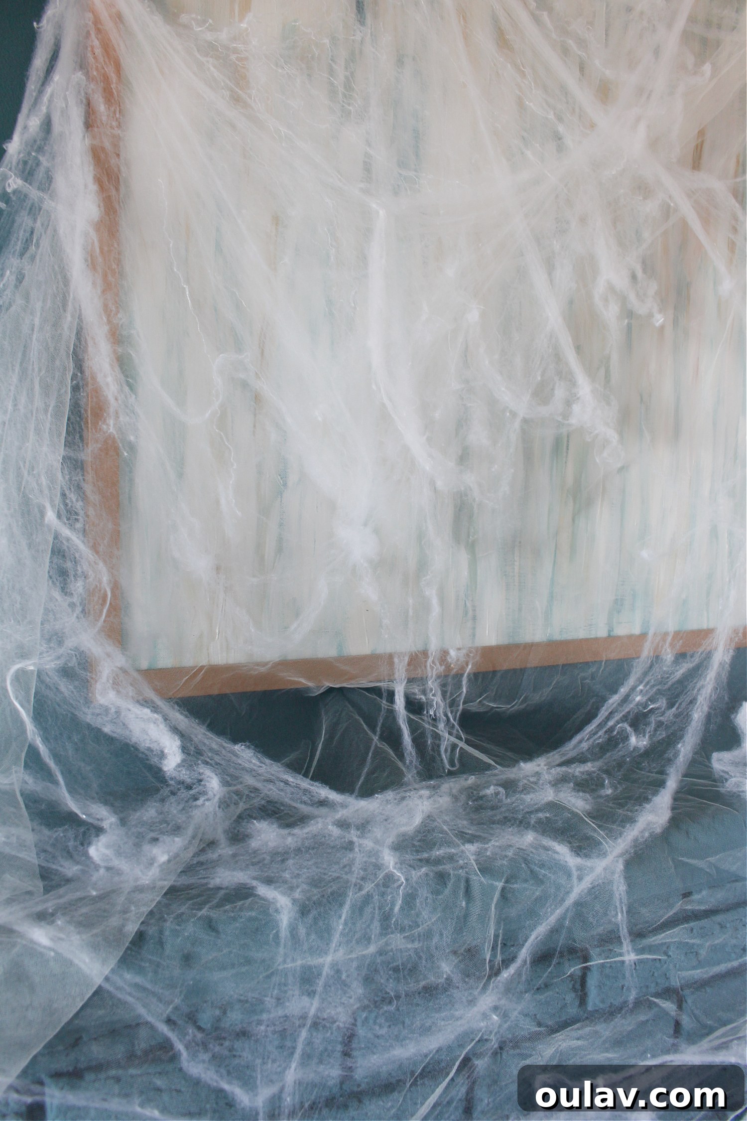 Eerie Elegance: DIY Spiderweb Halloween Mantel 5 Fireplace Draped with Ethereal Fake Cobwebs and Tulle