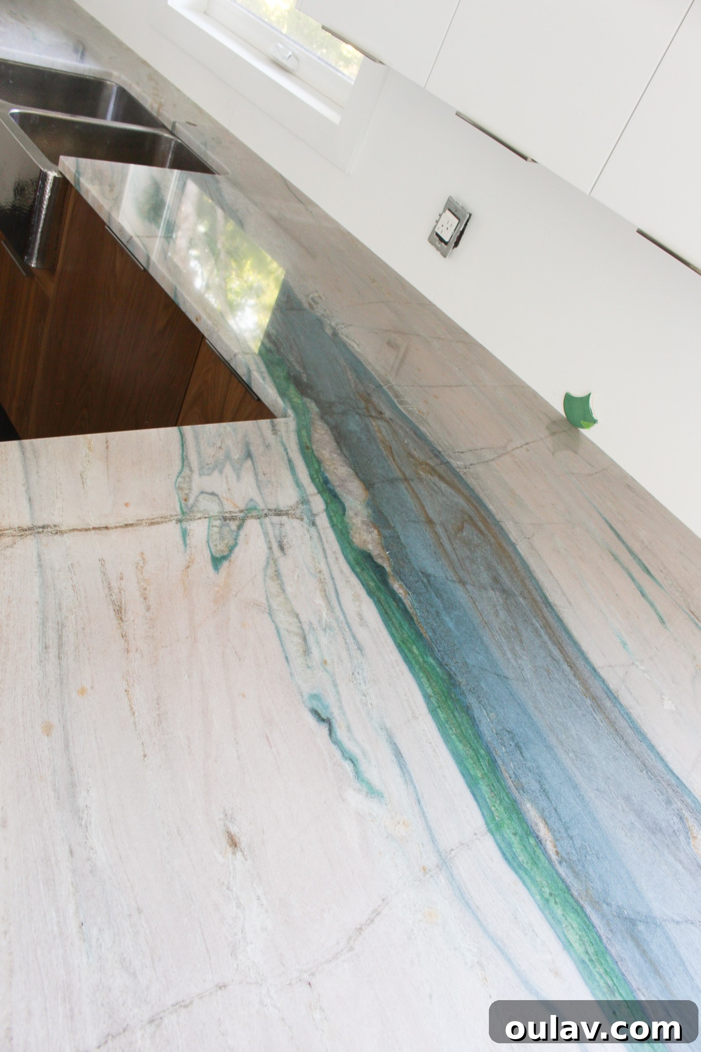 Expertly installed Portomare Quartzite kitchen counters, a beautiful blend of teal, blue, aqua, and green