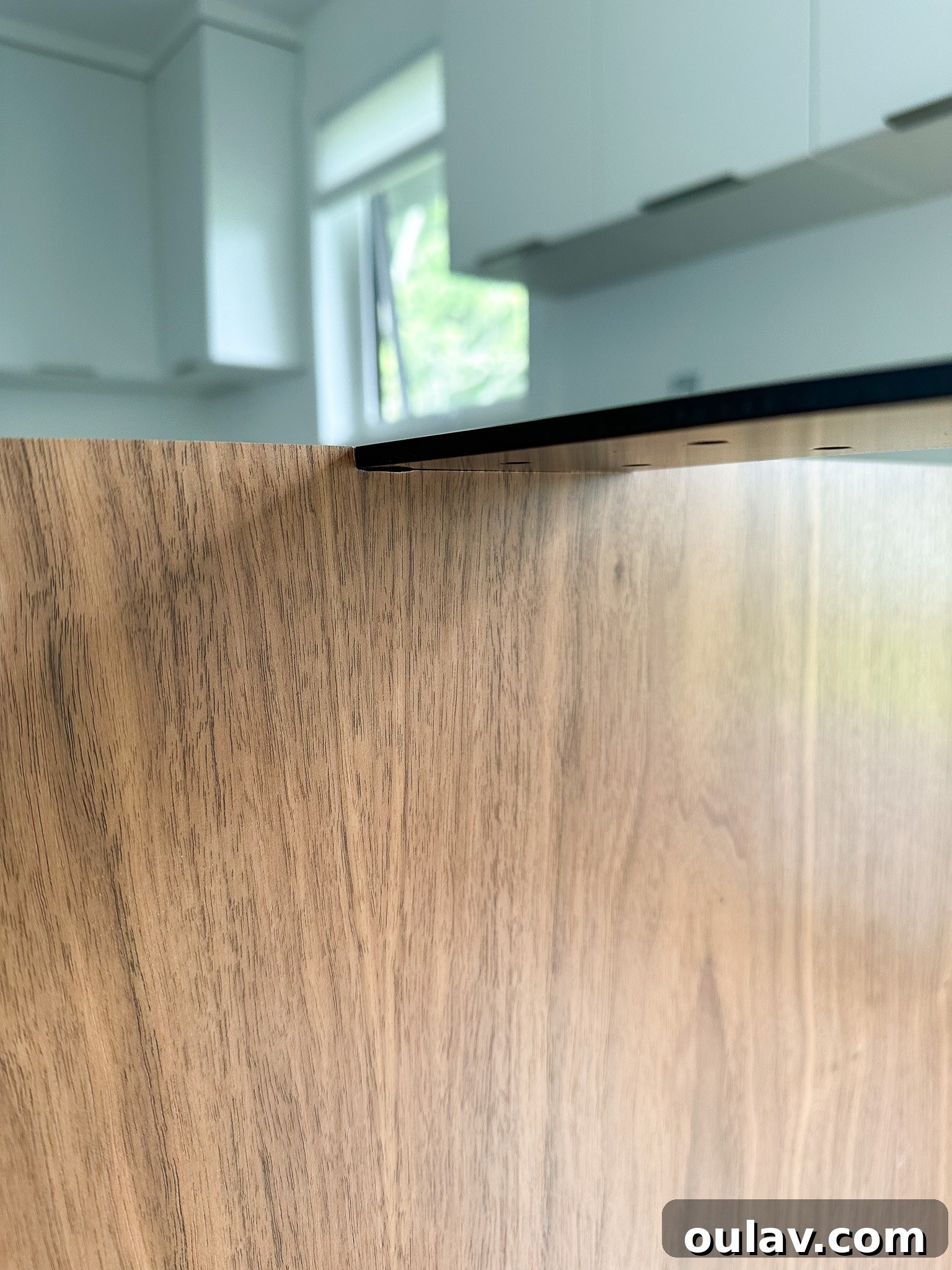 Close-up of sturdy metal support brackets installed under kitchen counter overhang