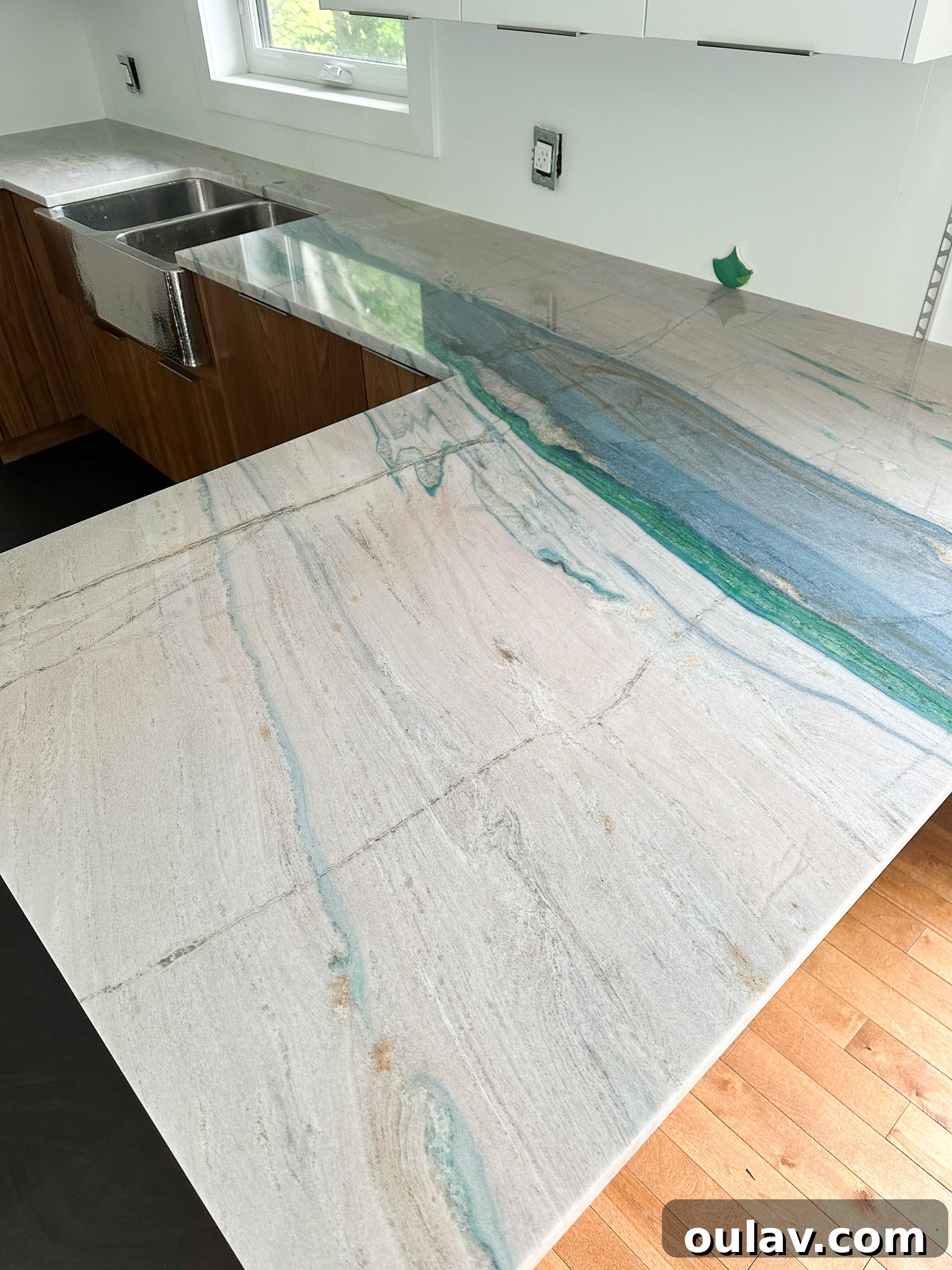 Newly installed Portomare Quartzite kitchen counters, featuring a seamless flush fit and expertly cut sink area