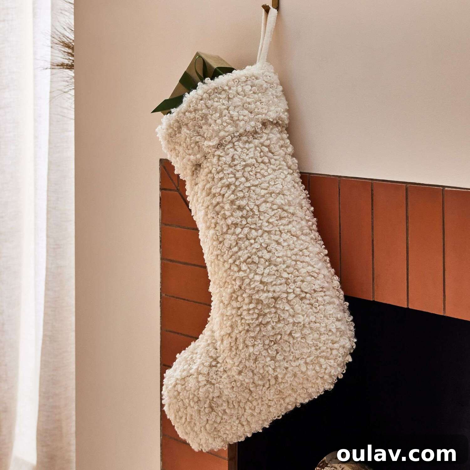 25 White Christmas Tree Decorations & Elegant Decor Finds 19 Boucle Christmas Stocking with Modern Texture