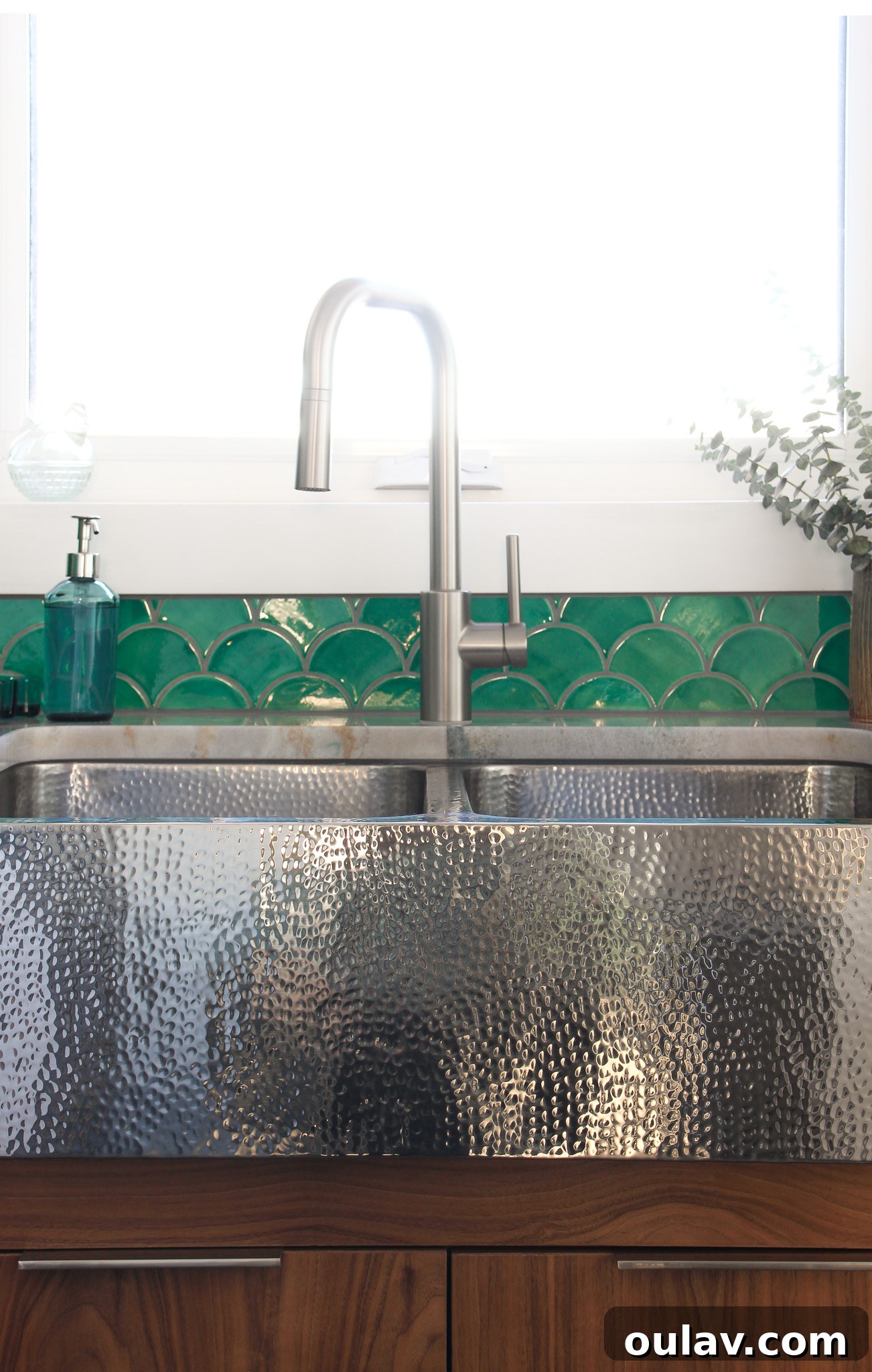 Mid-Century Modern Coastal Kitchen Reveal 18 Quiroga Hammered Stainless Steel Double Bowl, reflecting light beautifully