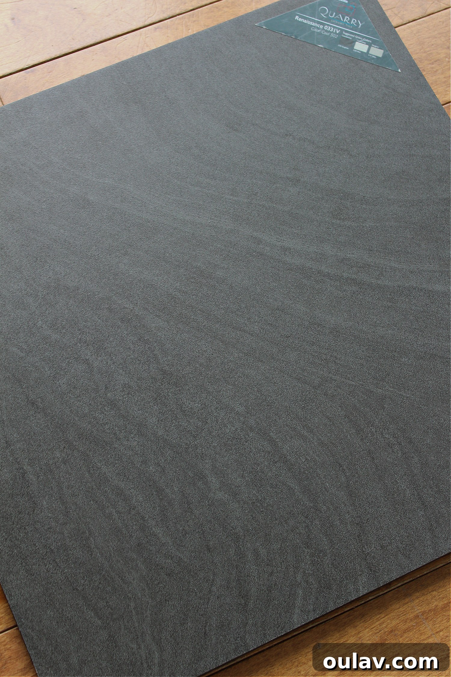 Mid-Century Modern Coastal Kitchen Reveal 32 Luxury Vinyl Tile resembling black beach sand in a coastal home