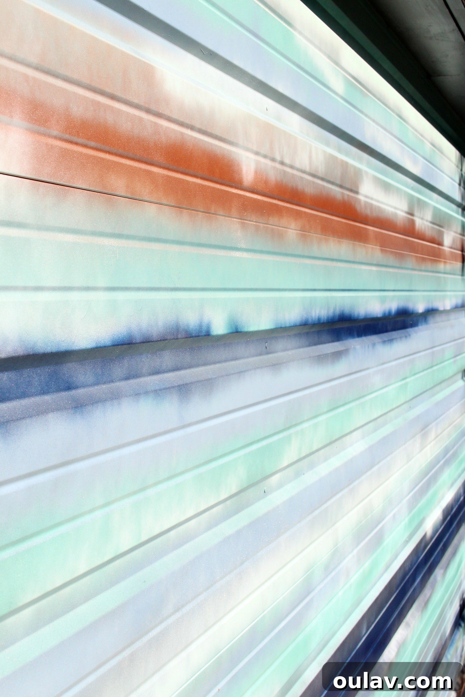 Coastal Canvas Garage Makeover 13 Light Catching Effects on Blue and Copper Garage Door Art
