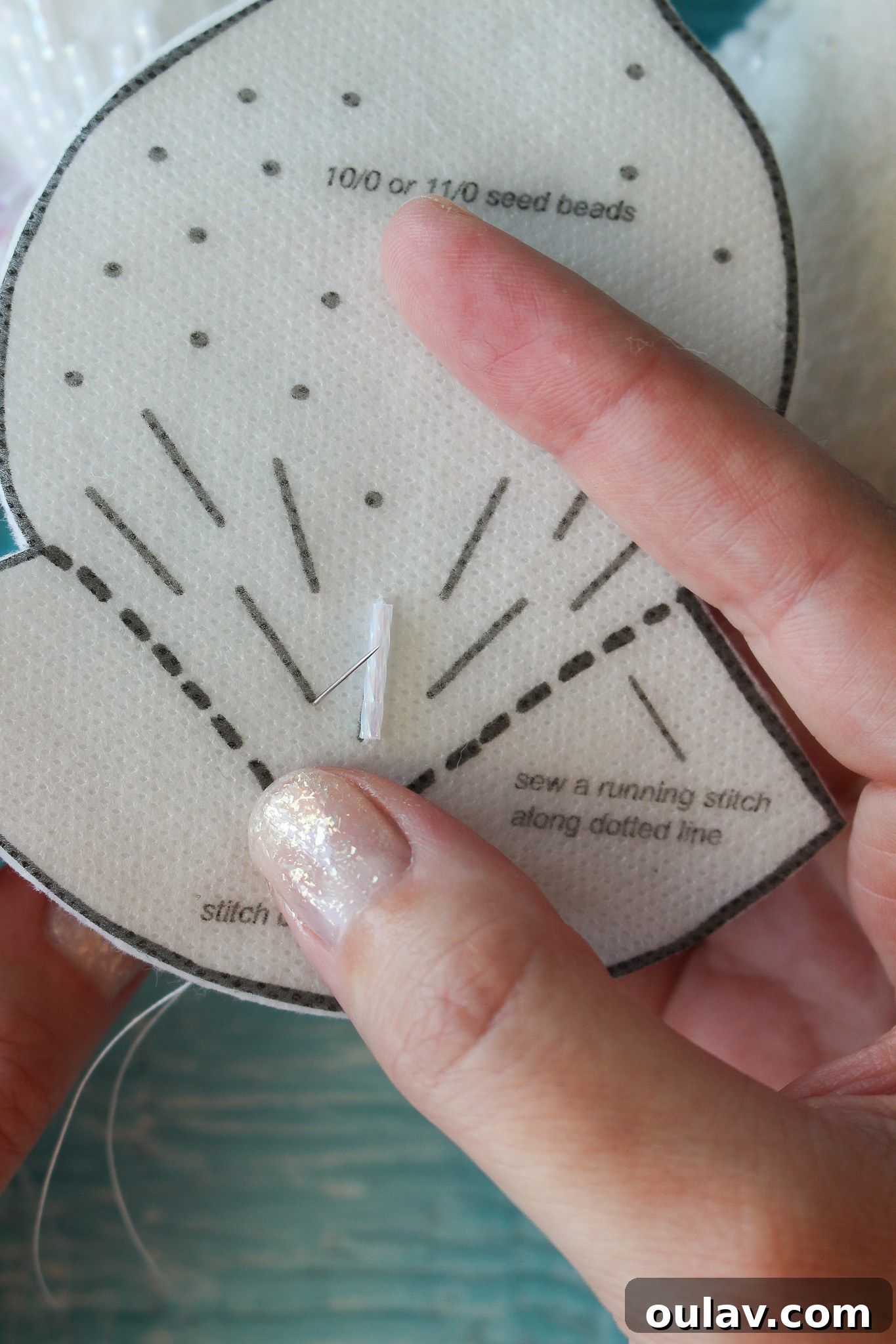 How to Stitch Beads onto Felt - Needle coming up