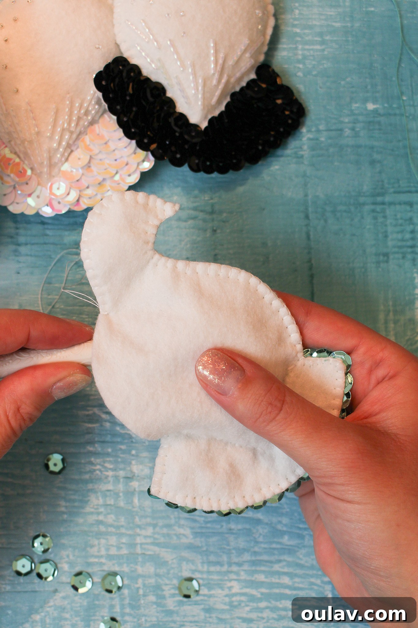 Stuffing the felt bird ornament