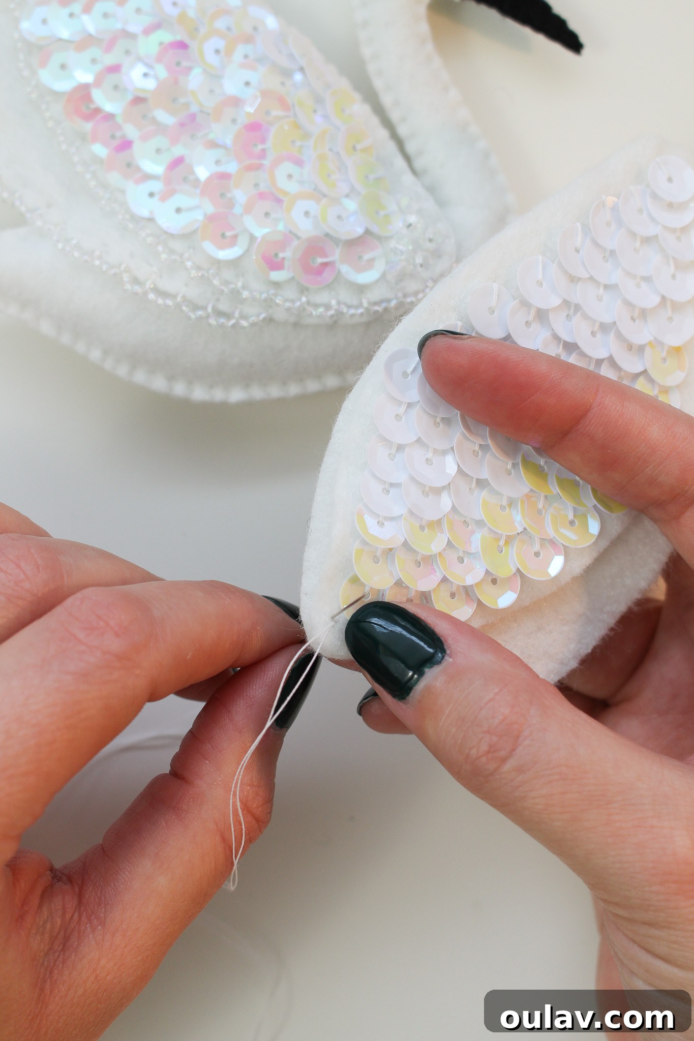Stitch Your Own Felt Swan Ornament 17 Continuing a blanket stitch for felt ornament assembly