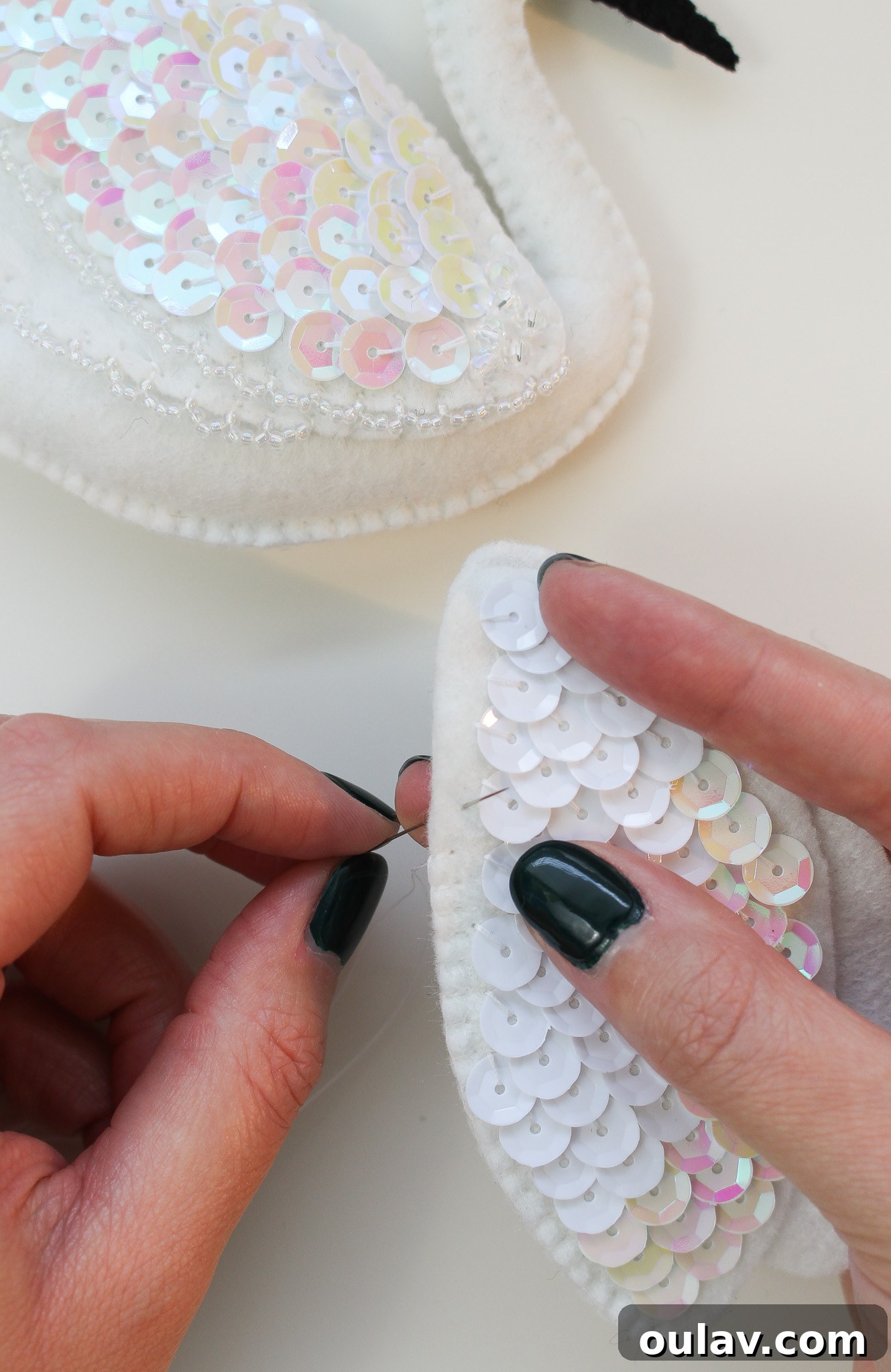 Stitch Your Own Felt Swan Ornament 22 Final steps of blanket stitch on a felt ornament