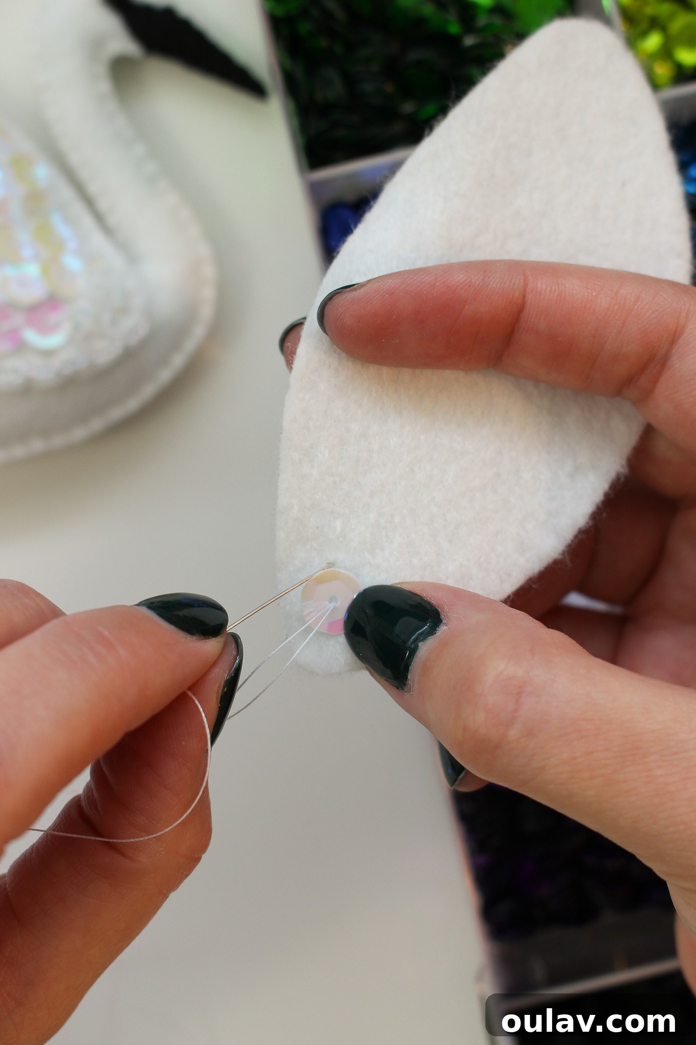 Stitch Your Own Felt Swan Ornament 9 Sewing sequins onto felt for ornament decoration