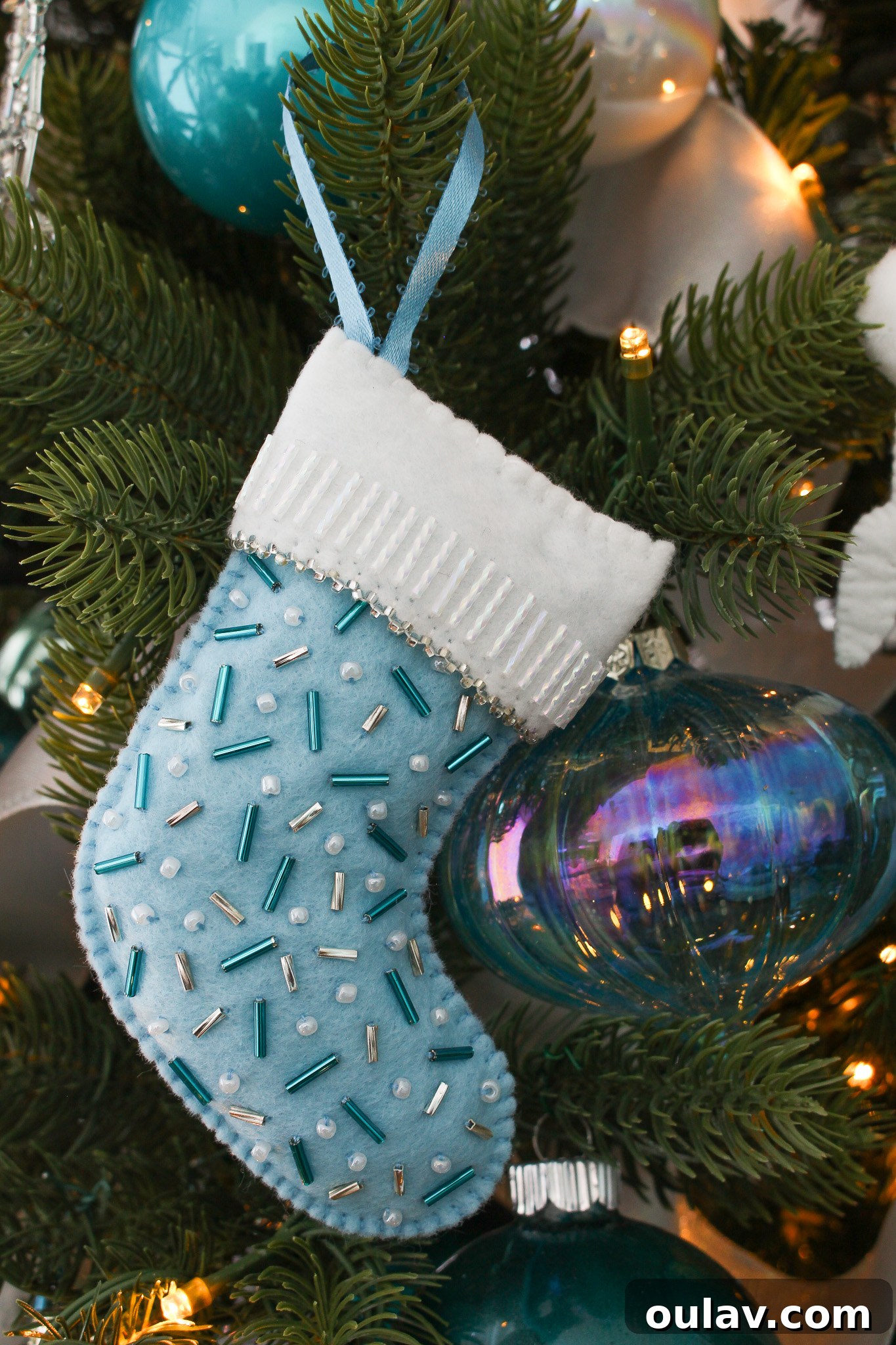 Charming Felt Mitten Garland 12 DIY Felt Stocking Ornament Idea: A final inspiring image of the handcrafted felt stocking ornament, ready for holiday display.