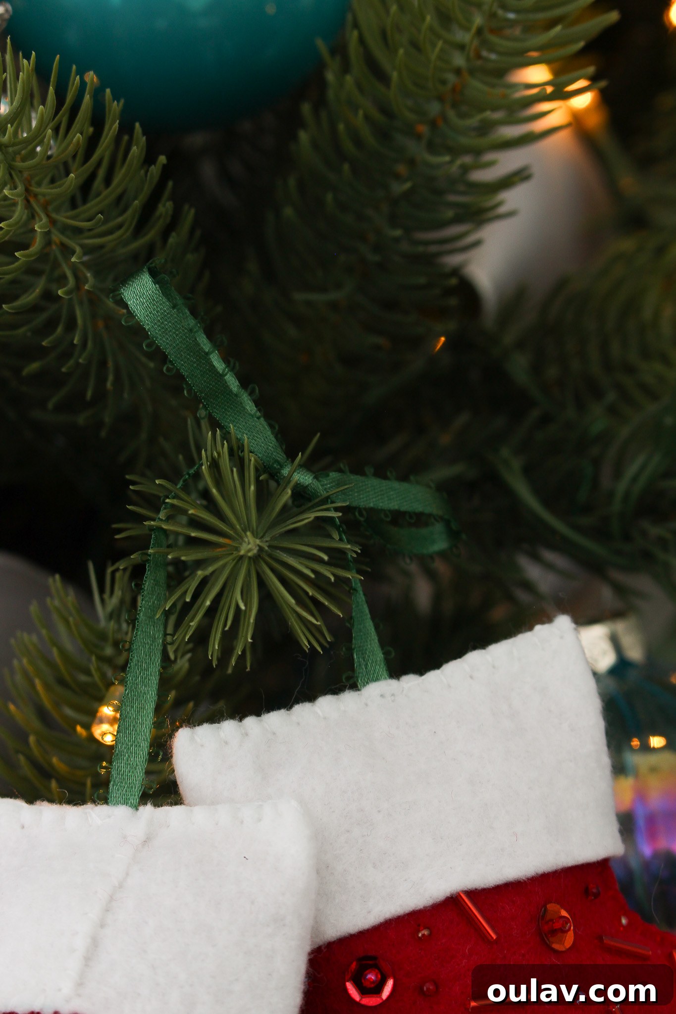 Charming Felt Mitten Garland 5 How to Make Mittens on a String Ornaments: Detailed view of the back of the felt mitten ornament, highlighting the cuff attachment.