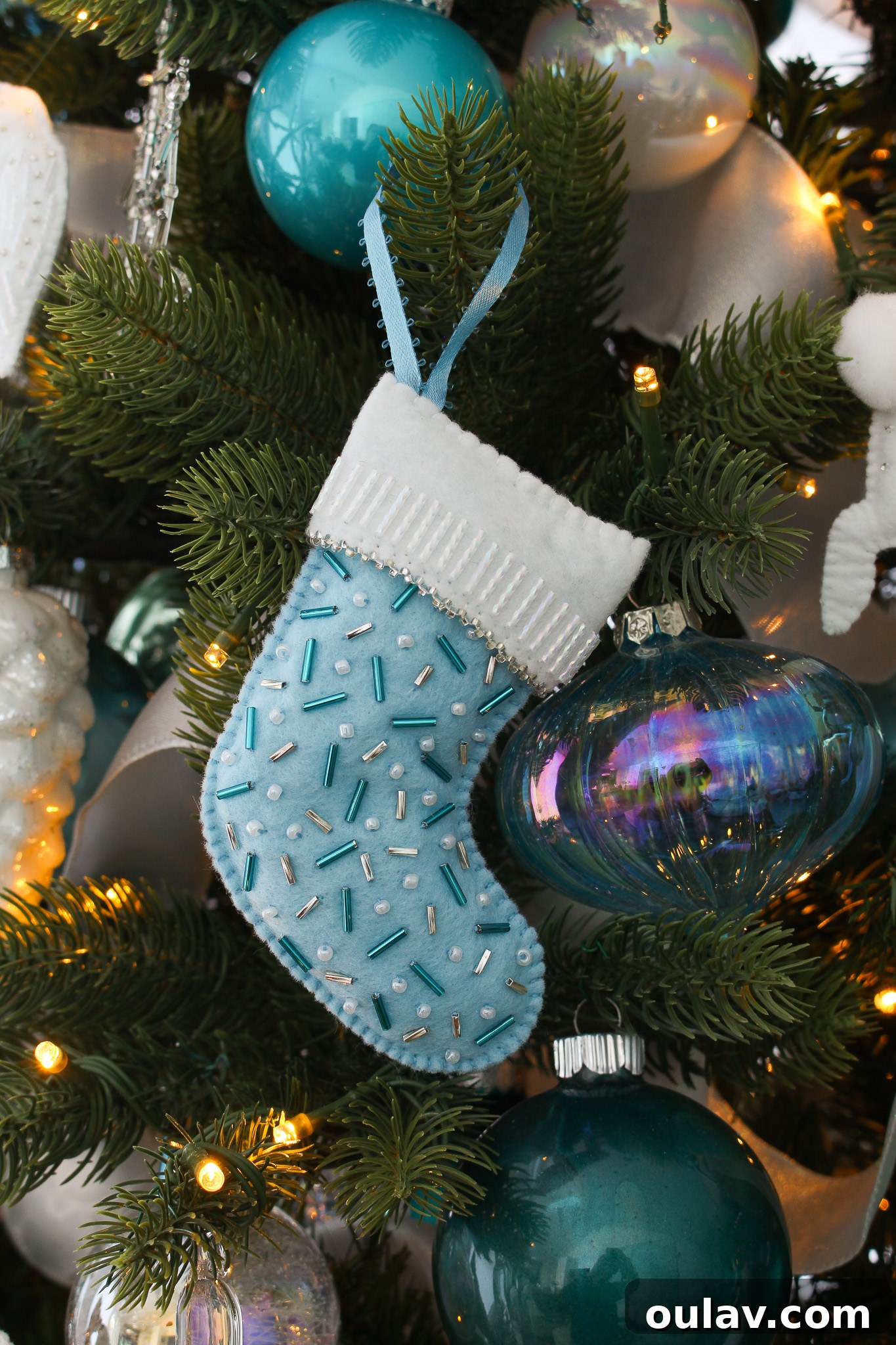 Charming Felt Mitten Garland 9 DIY Beaded Felt Stocking Shaped Ornament: Discover another creative reuse of the felt cookie pattern, transformed into a beaded stocking.