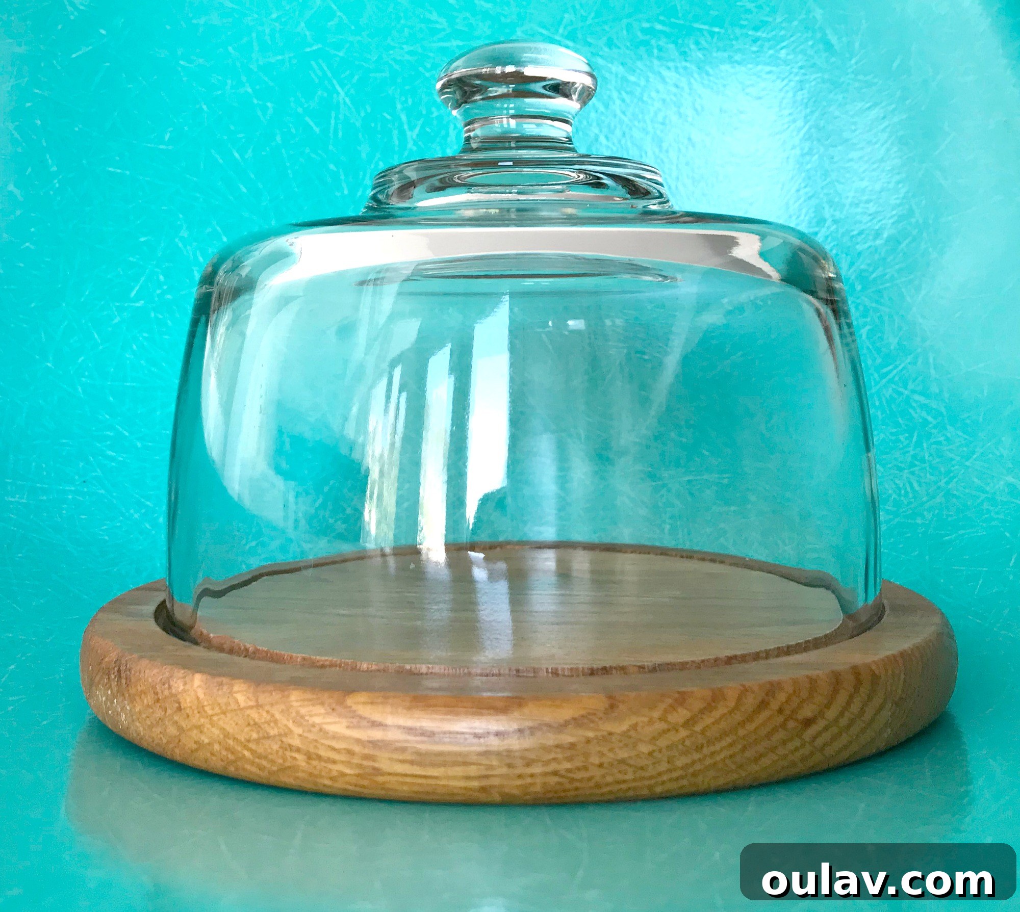 Gearhead's Festive Display Dome 11 Overhead view of a glass cloche base painted in serenity blue, preparing for a DIY winter diorama project.