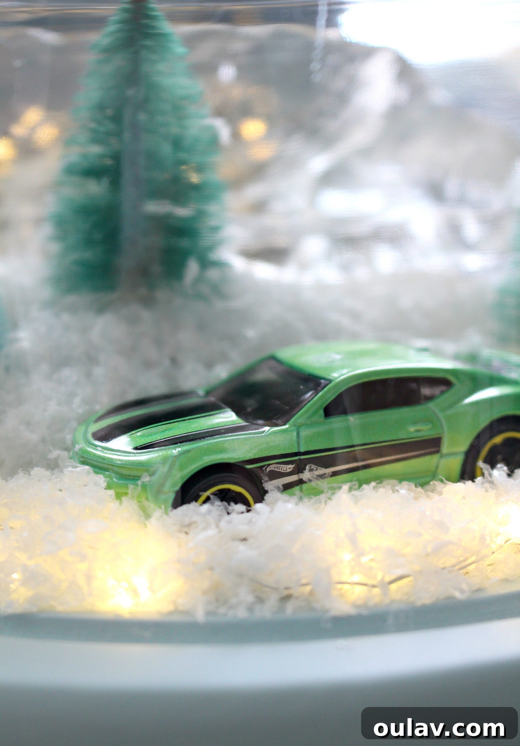 Gearhead's Festive Display Dome 7 Festive homemade Christmas cloche featuring a miniature green Camaro, creating a personalized holiday display.