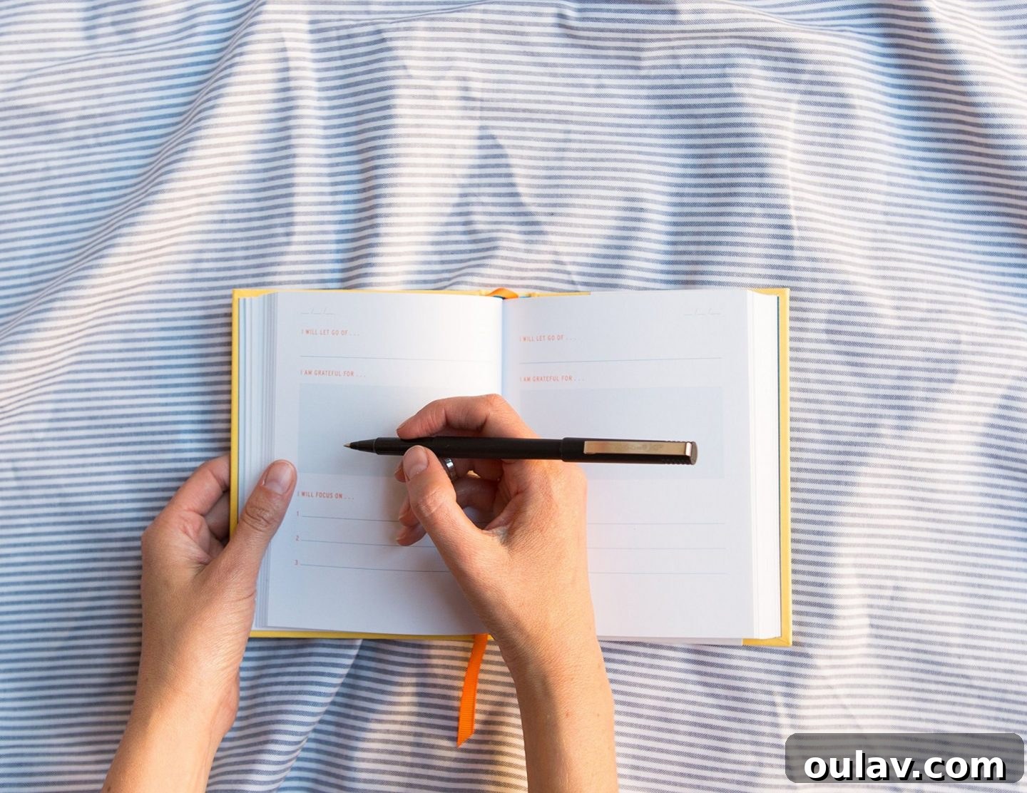 Holiday Haven: 25 Delightful Gifts for Homebodies 14 A Two Minute Morning Journal with a stylish pen, emphasizing mindfulness for homebodies.