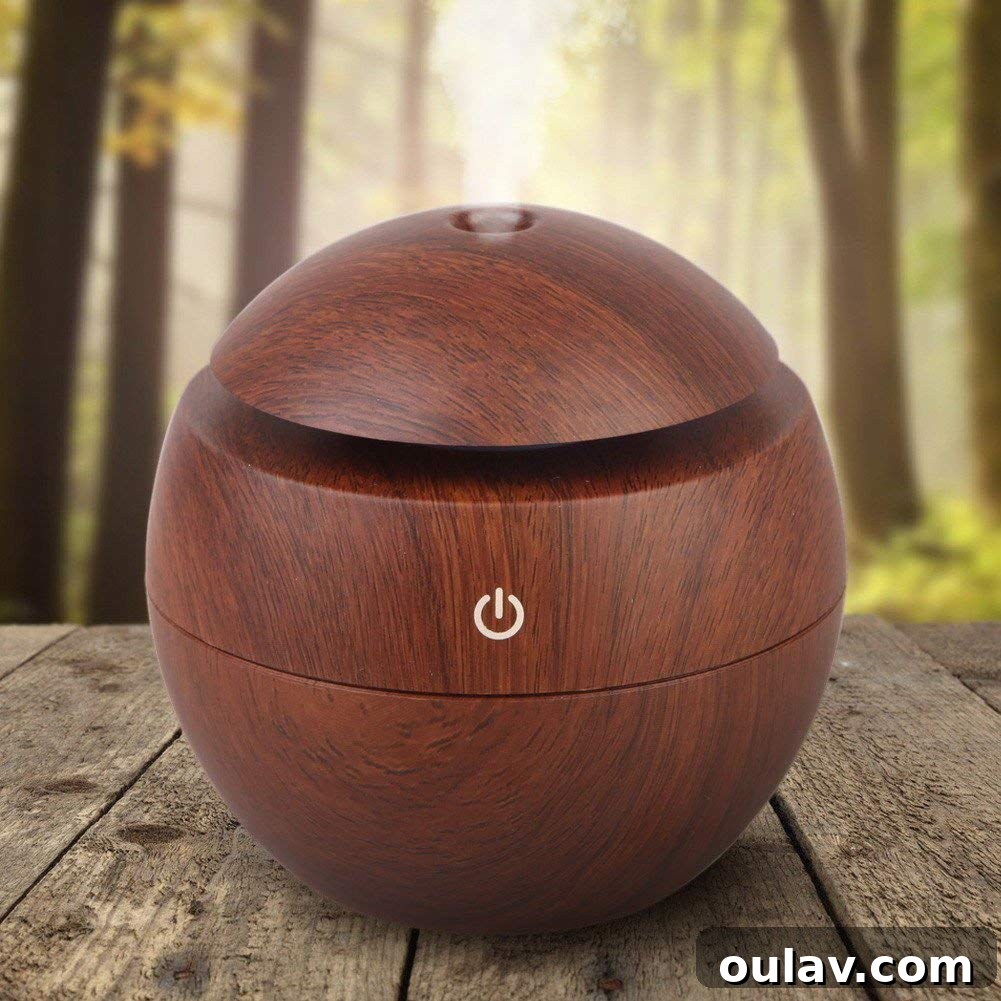 Holiday Haven: 25 Delightful Gifts for Homebodies 17 A modern essential oil diffuser with a dark wood grain finish, creating a calming ambiance.