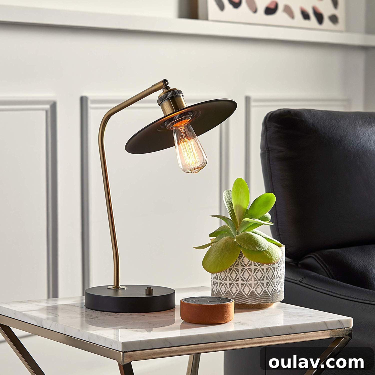 Holiday Haven: 25 Delightful Gifts for Homebodies 19 A small geometric ceramic planter with a succulent, perfect for a tabletop.
