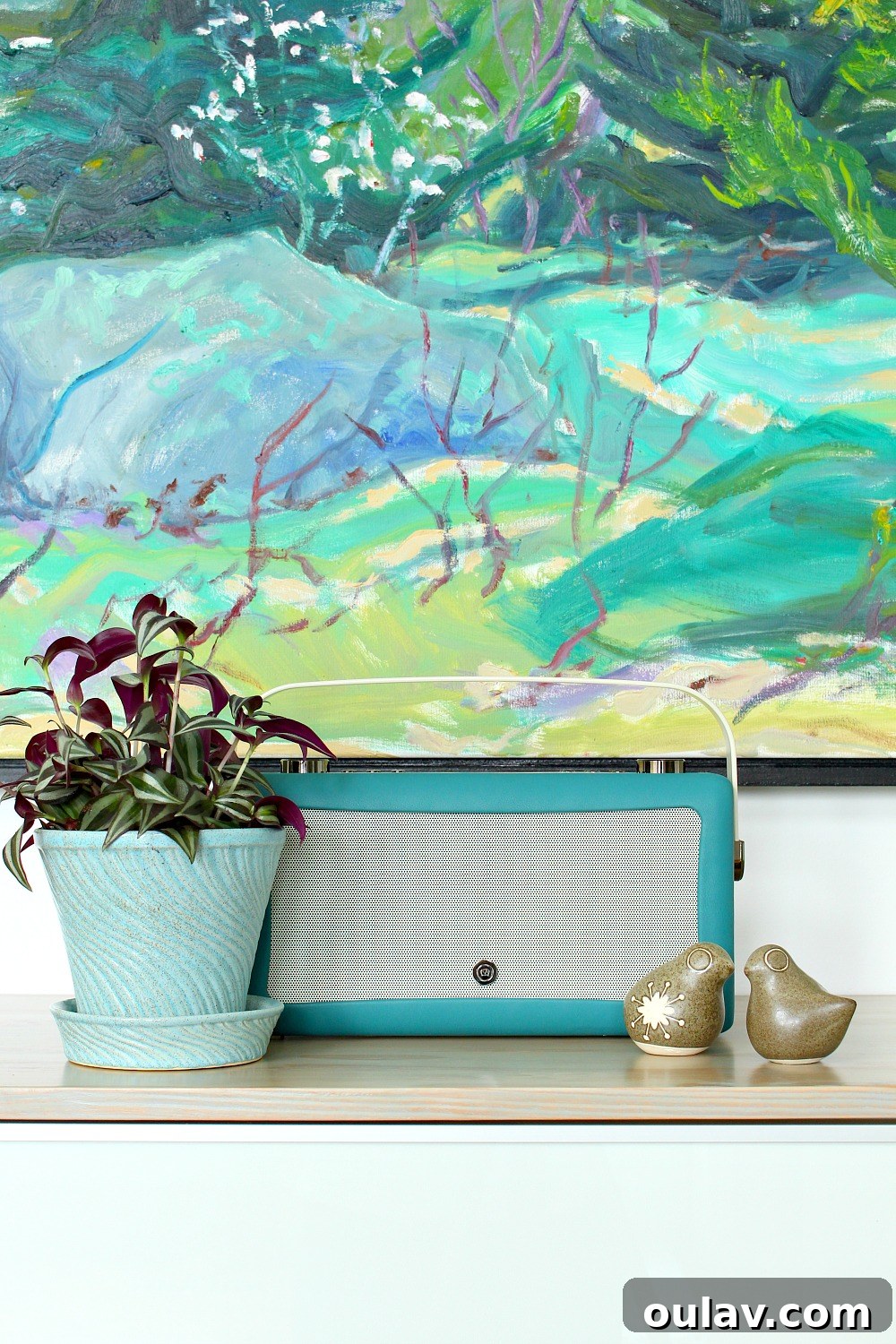 Holiday Haven: 25 Delightful Gifts for Homebodies 25 A vintage-inspired VQ Hepburn Bluetooth radio in teal, sitting on a wooden surface.