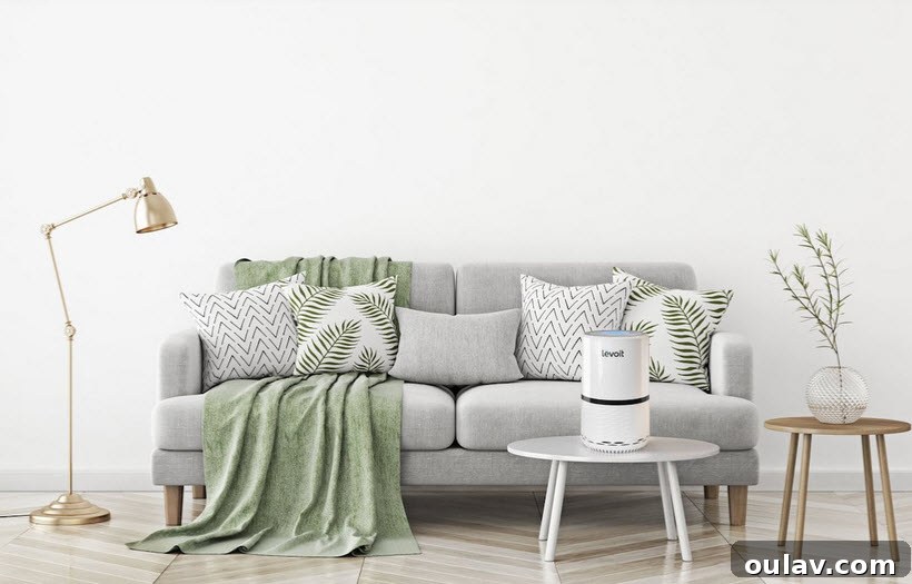 Holiday Haven: 25 Delightful Gifts for Homebodies 31 A sleek white Levoit Air Purifier, standing in a clean, modern room.