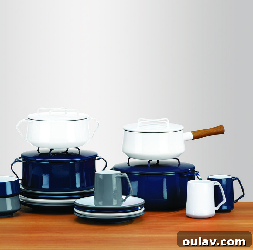 Holiday Haven: 25 Delightful Gifts for Homebodies 5 A Dansk Kobenstyle enamel pot in navy blue, alongside a Le Creuset braiser, perfect for home cooking.