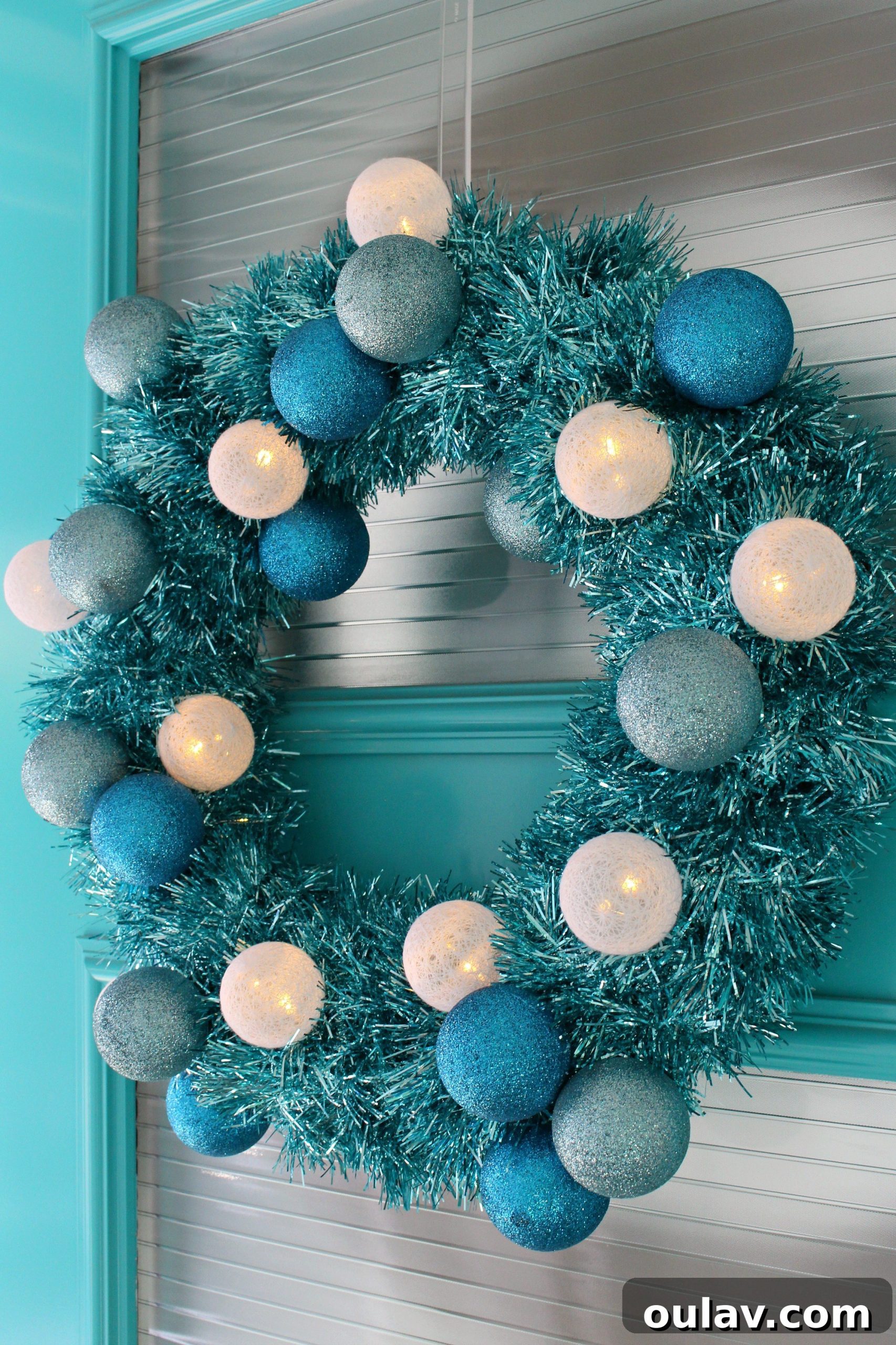 Retro Sparkle: Craft Your Own Tinsel Wreath 8 DIY Turquoise Tinsel Wreath on a Turquoise Front Door