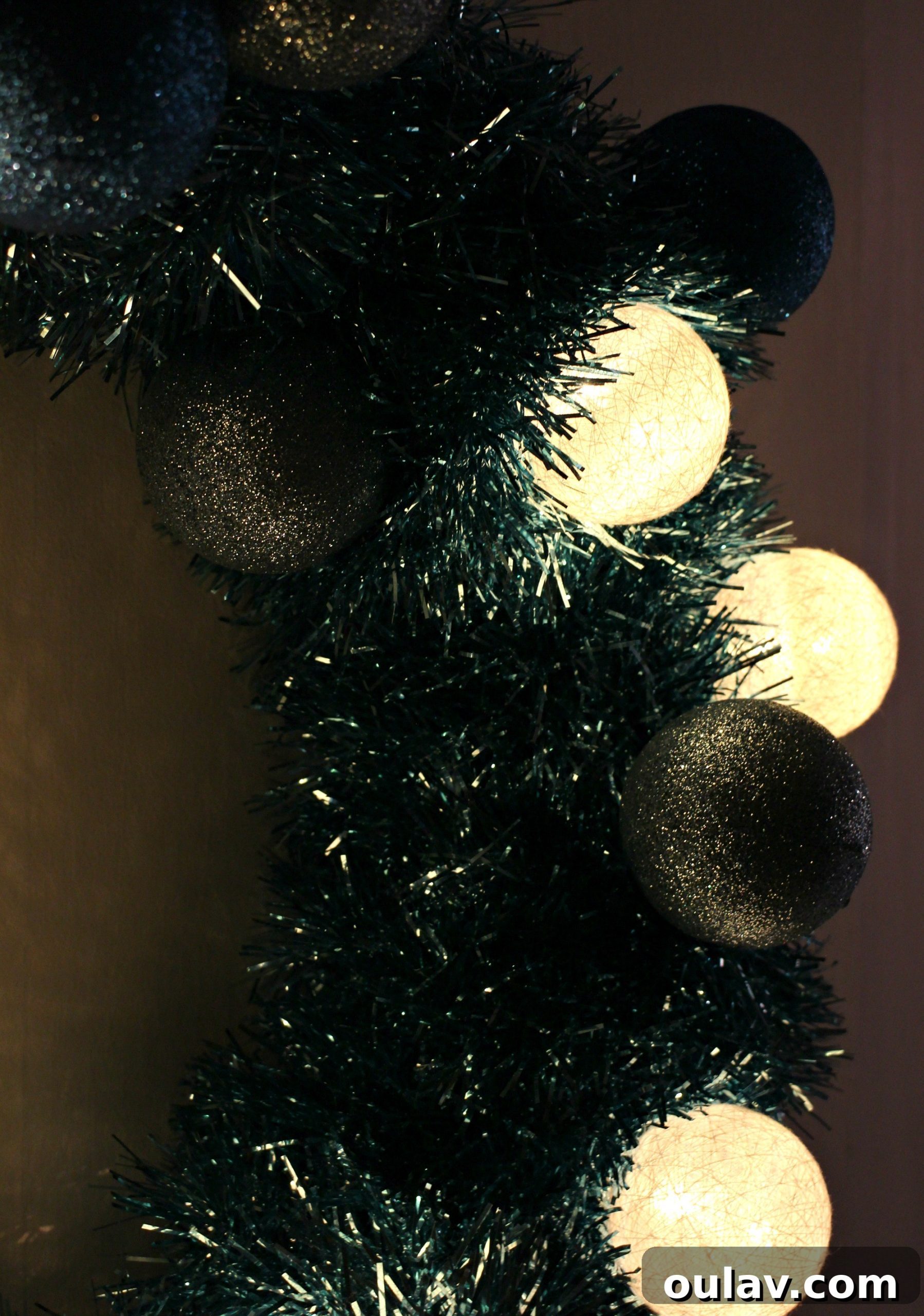 Retro Sparkle: Craft Your Own Tinsel Wreath 10 DIY Tinsel Wreath Lit Up at Night with Retro Christmas Charm