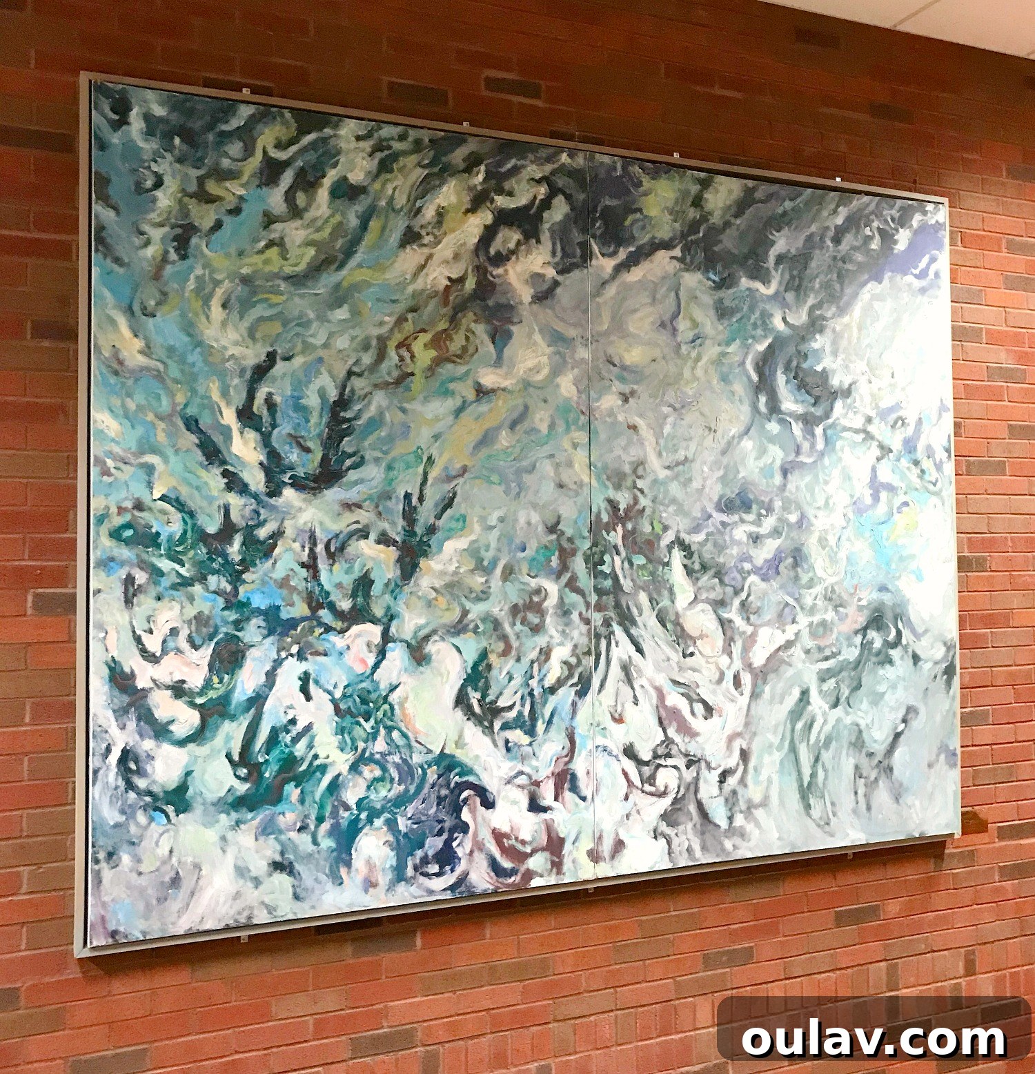 Inspiring art display at Laurentian University featuring Bert's work alongside Group of Seven, showcasing effective large art hanging.