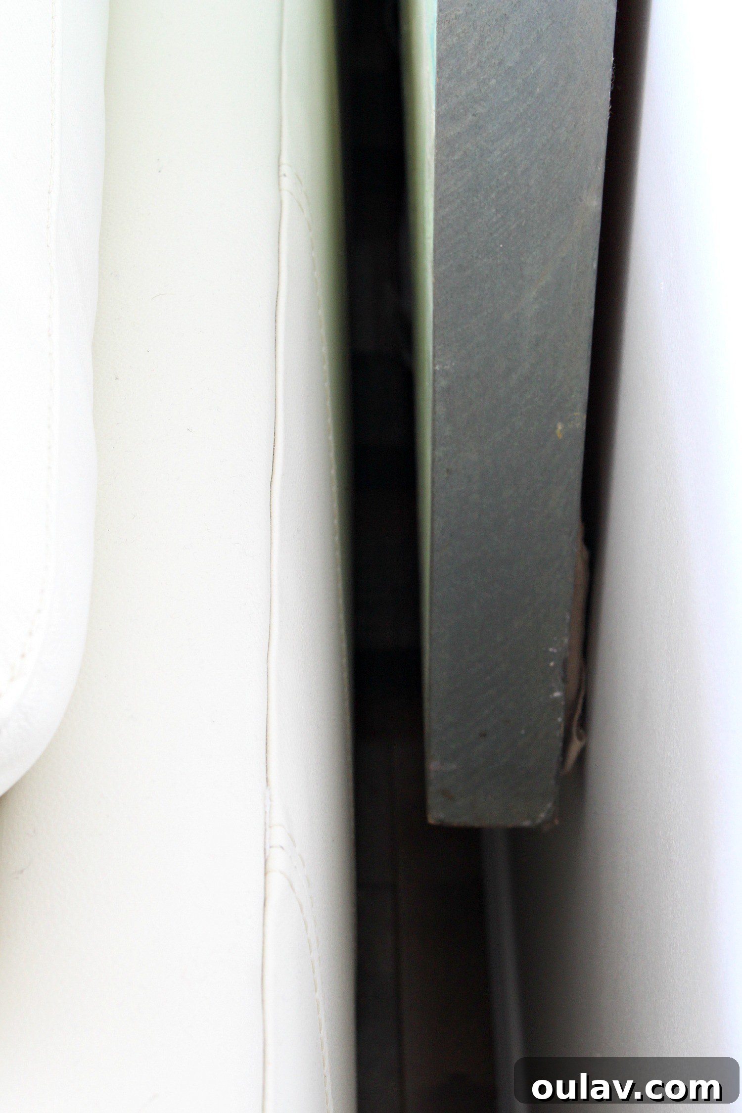 Another perspective showing the minimal yet effective gap between sofa and art, ensuring protection from impact.