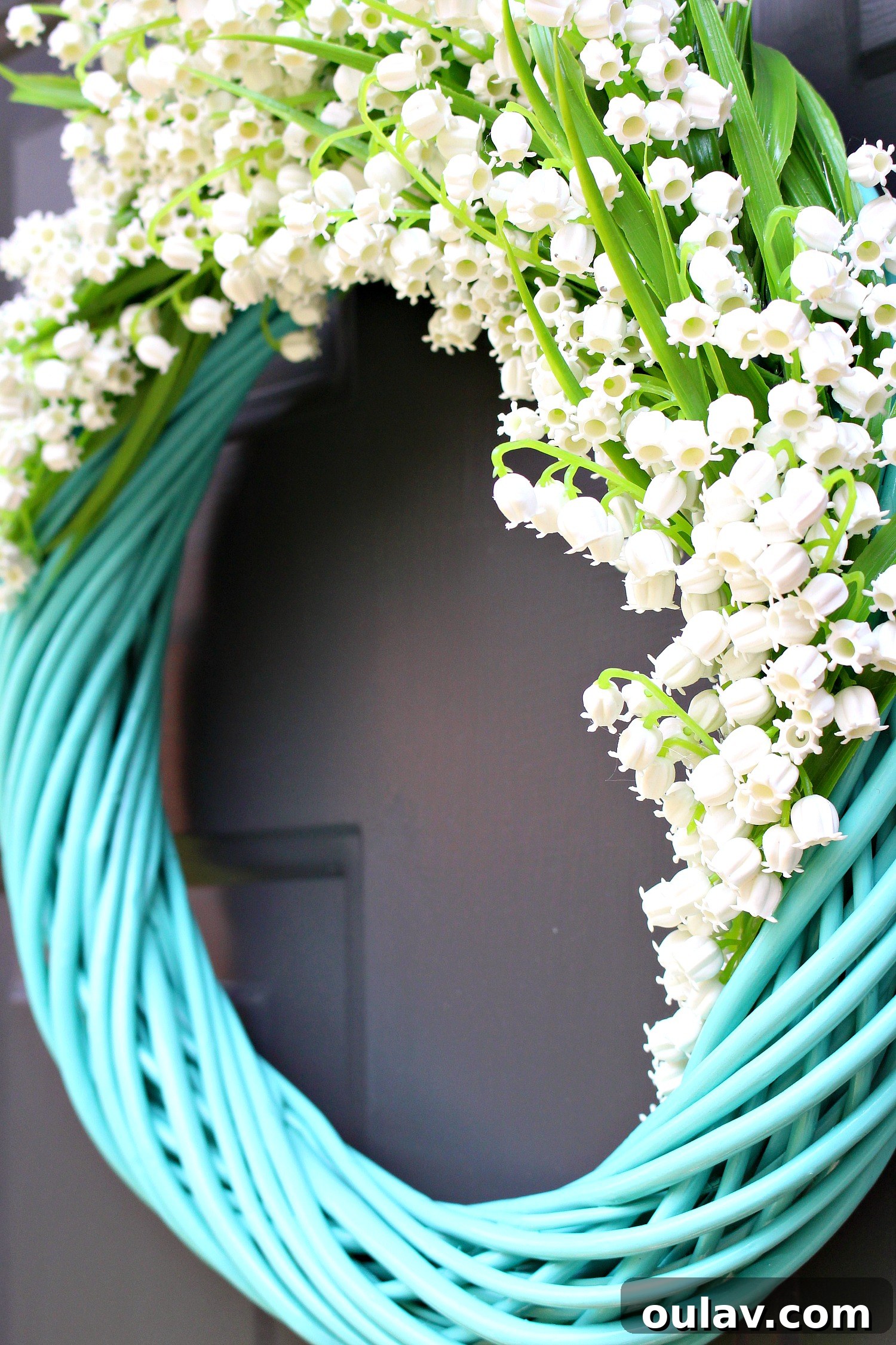 Effortless Turquoise Lily Faux Wreath 15 Completed section of the DIY faux Lily of the Valley wreath, showcasing dense flower placement