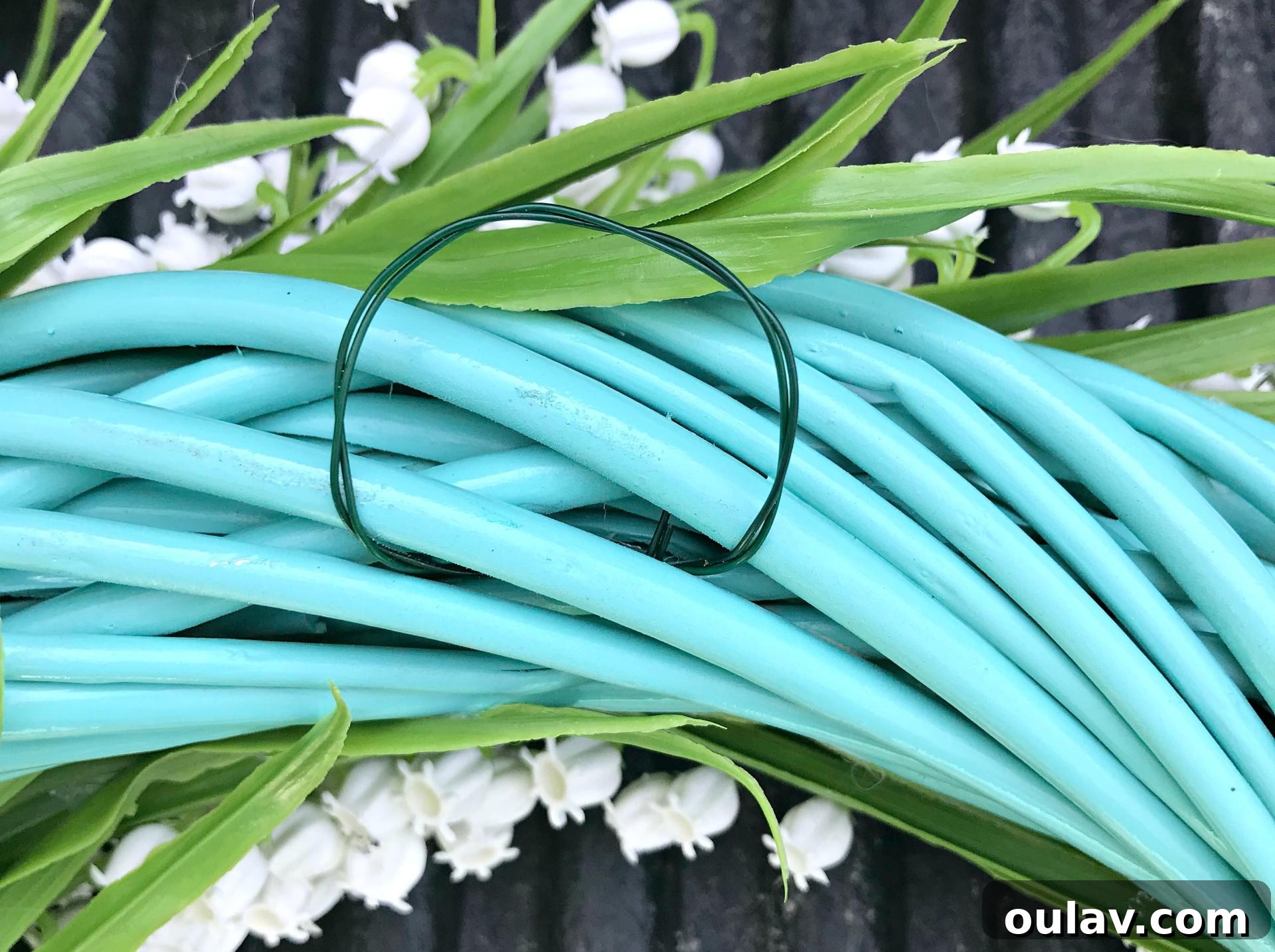 Effortless Turquoise Lily Faux Wreath 16 Close-up of a simple wire loop attached to the back of the wreath for hanging