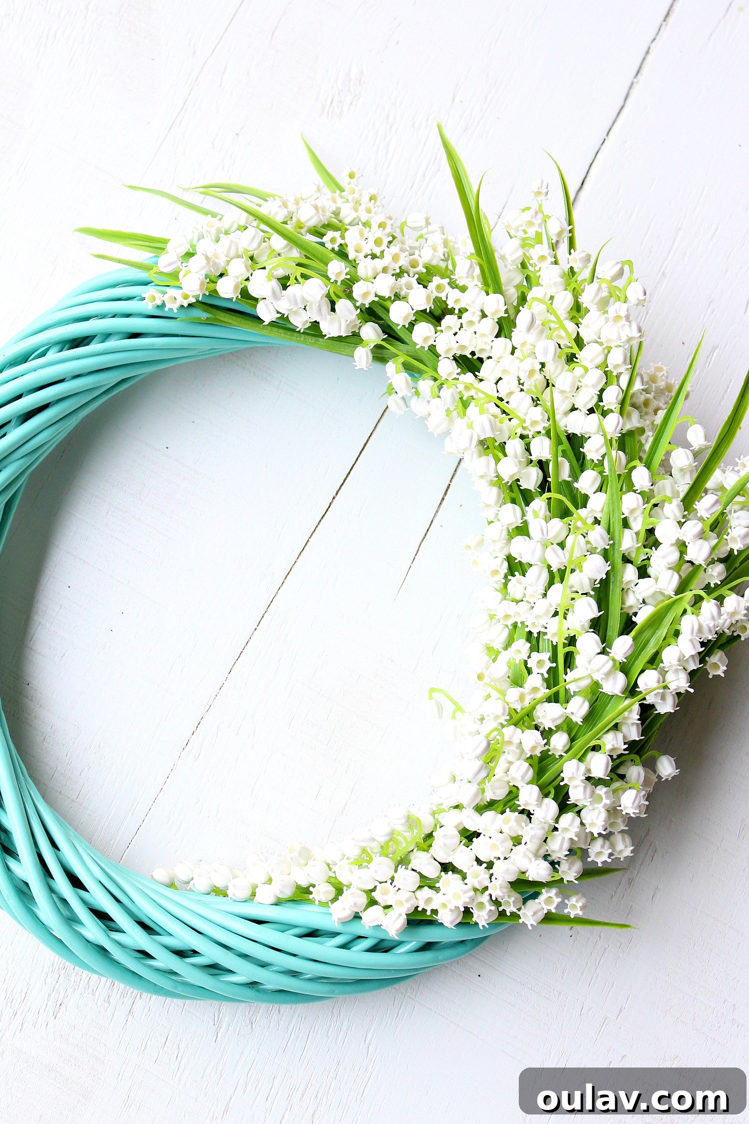 Effortless Turquoise Lily Faux Wreath 18 Another perspective of the charming DIY Lily of the Valley wreath, highlighting its details