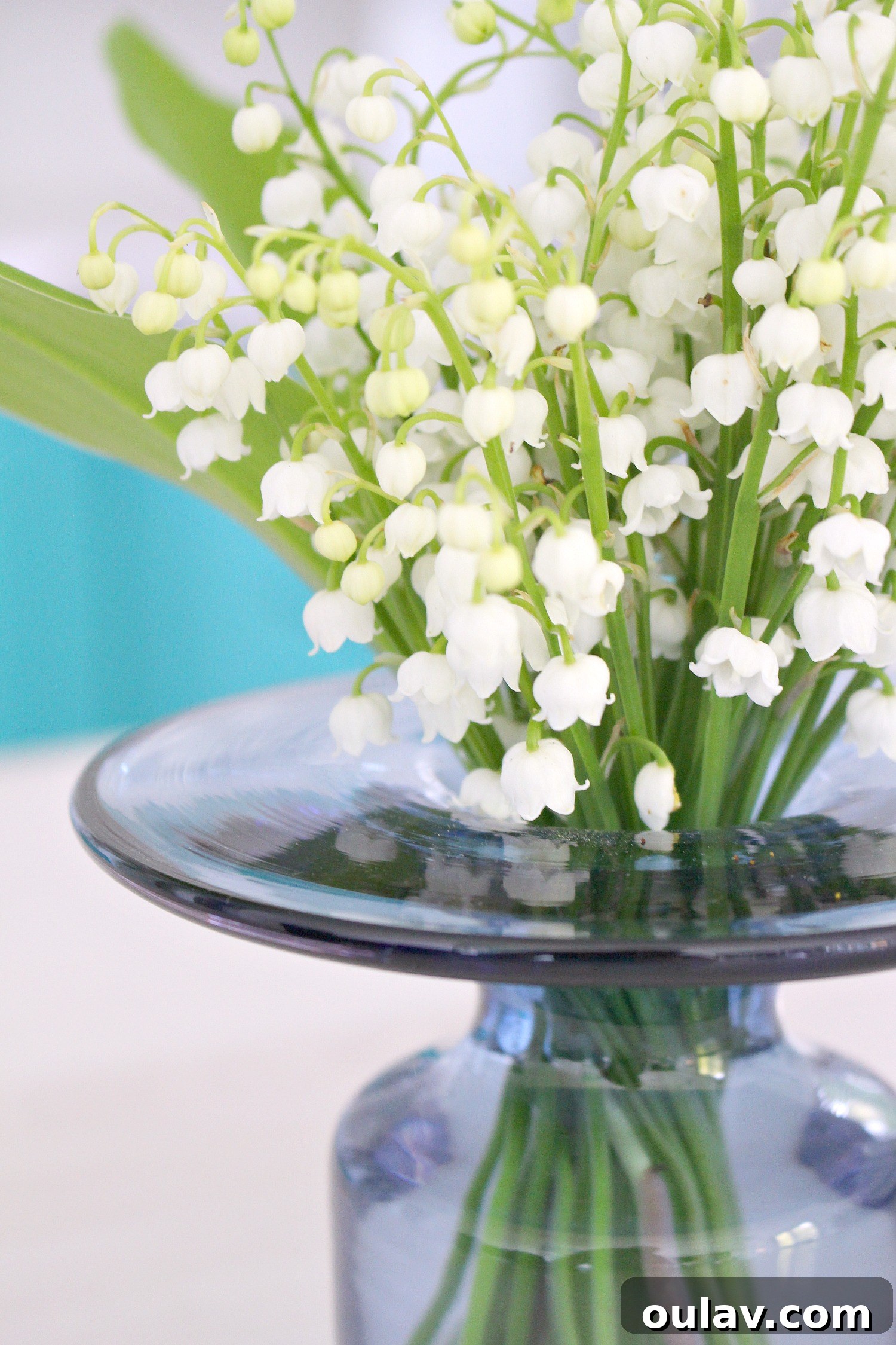 Effortless Turquoise Lily Faux Wreath 3 Close-up of elegant Lily of the Valley blossoms, symbolizing spring