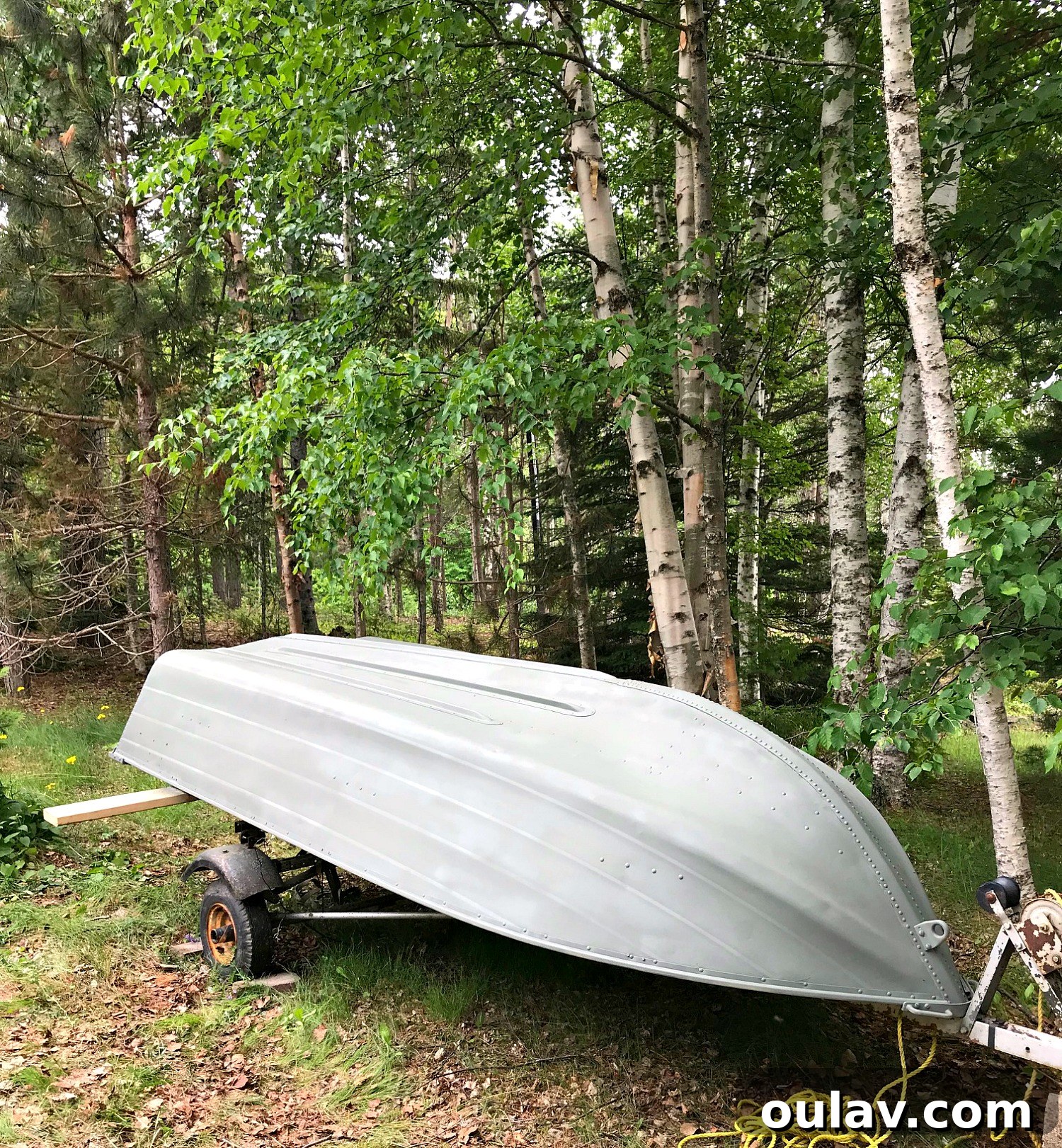 Close-up of the primer coating on the aluminum boat, showing smooth application.