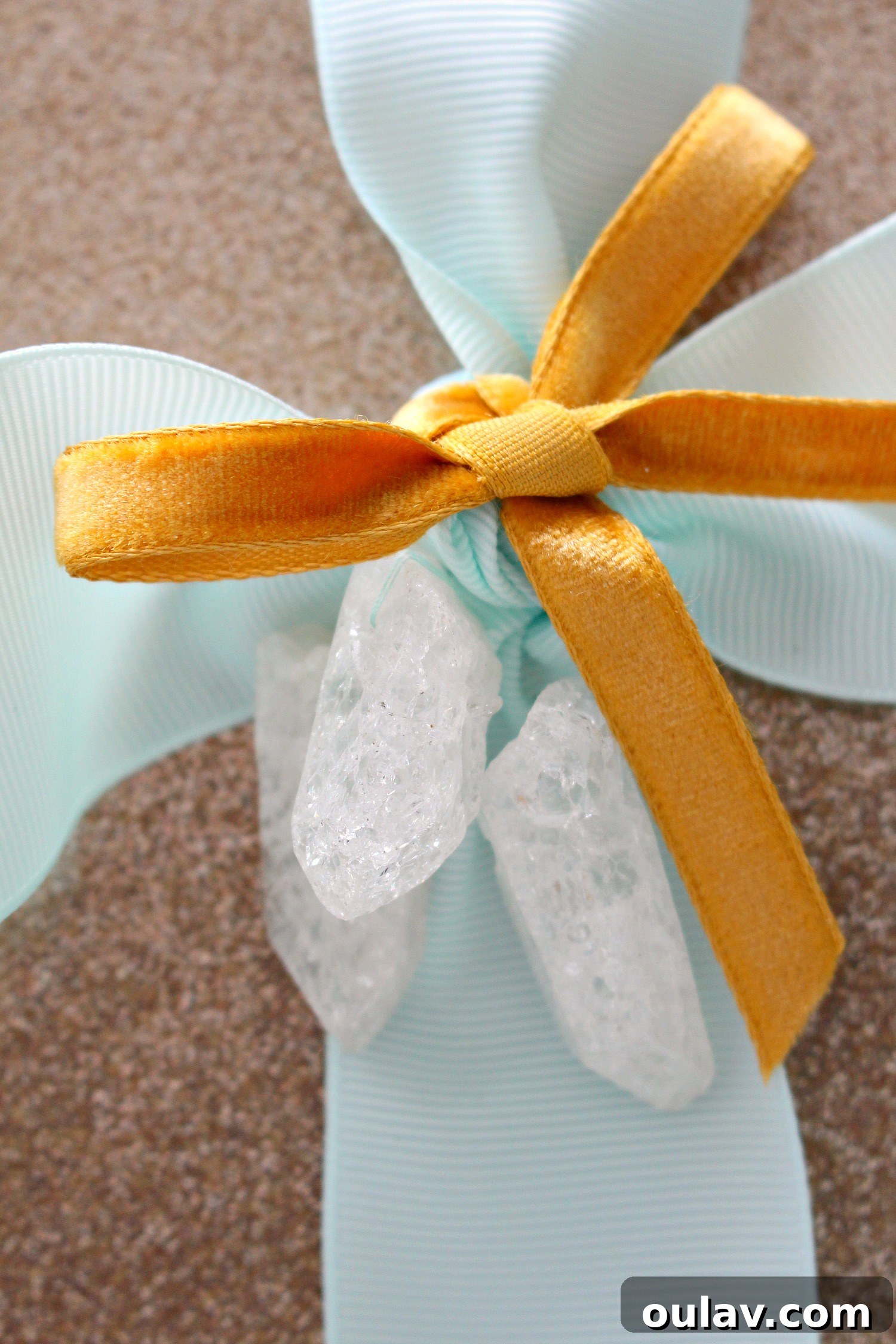 Crystal Point Glamour Gift Wrap 4 Side view of a glam gift wrap with aqua ribbon and crystal detail