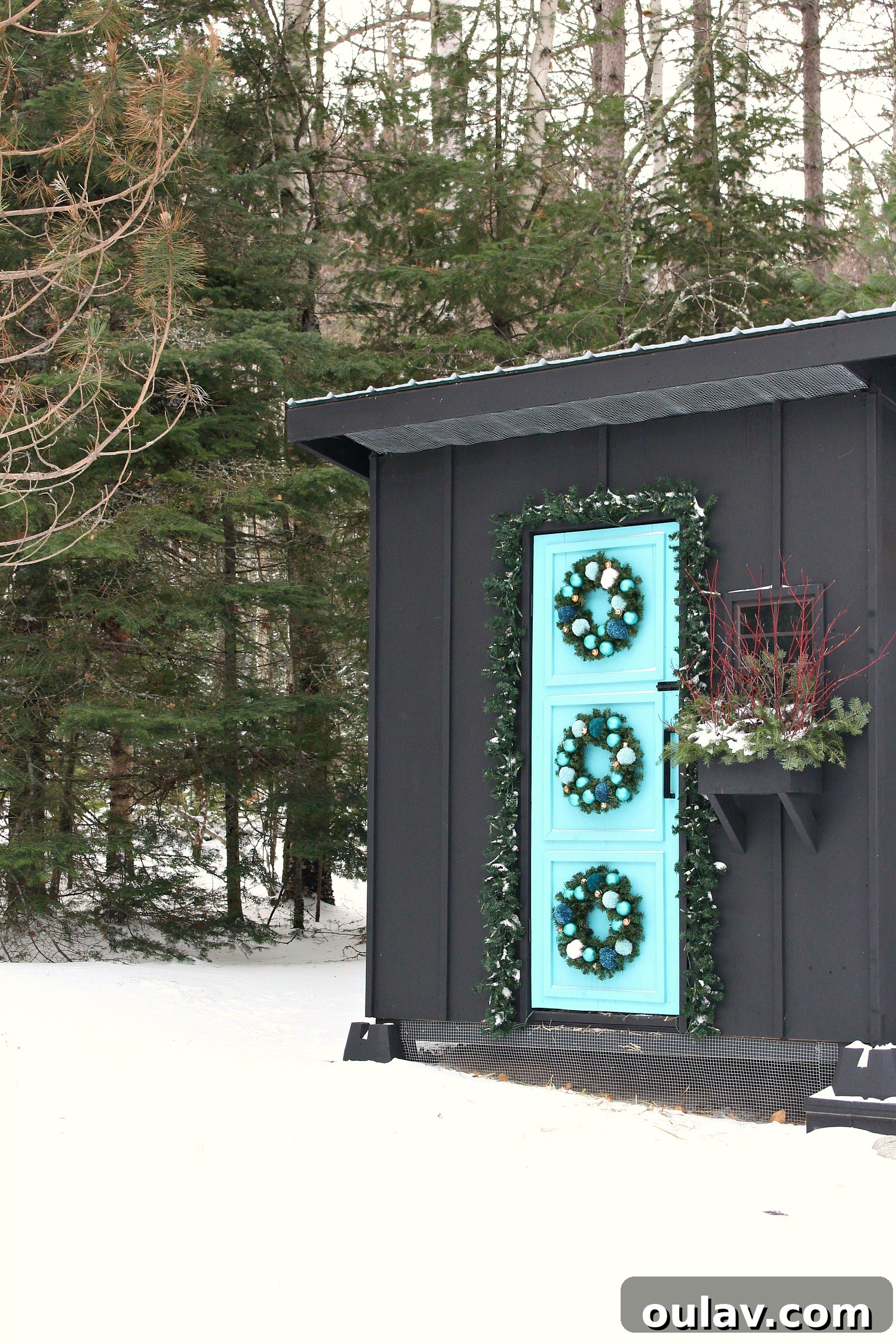 19 Top Picks from Dans le Lakehouse 2019 9 Three colorful DIY pom pom wreaths adorning a dark door, creating a festive look